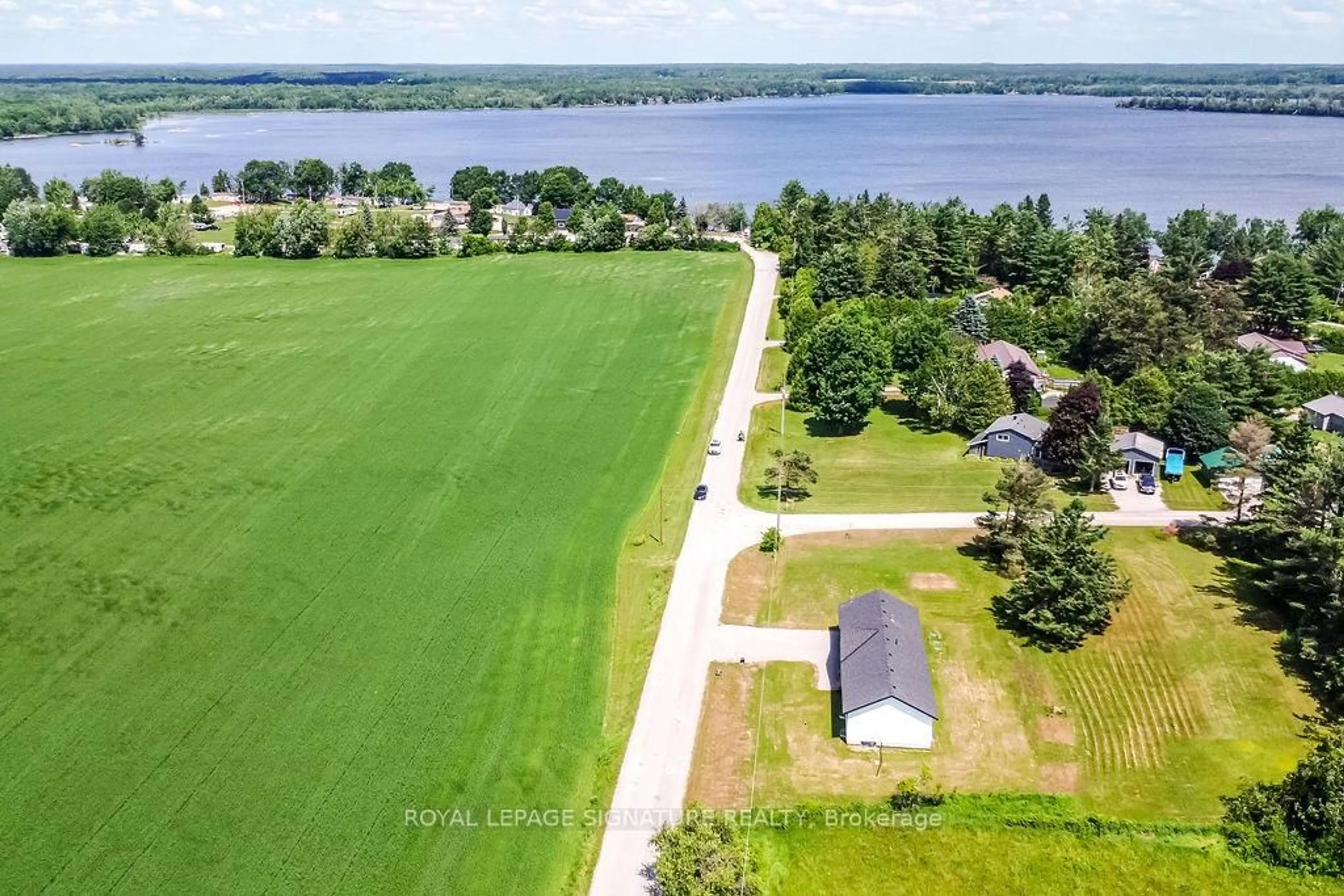 A pic from outside/outdoor area/front of a property/back of a property/a pic from drone, water/lake/river/ocean view for 122 Day Dr, Kawartha Lakes Ontario L3V 6H5