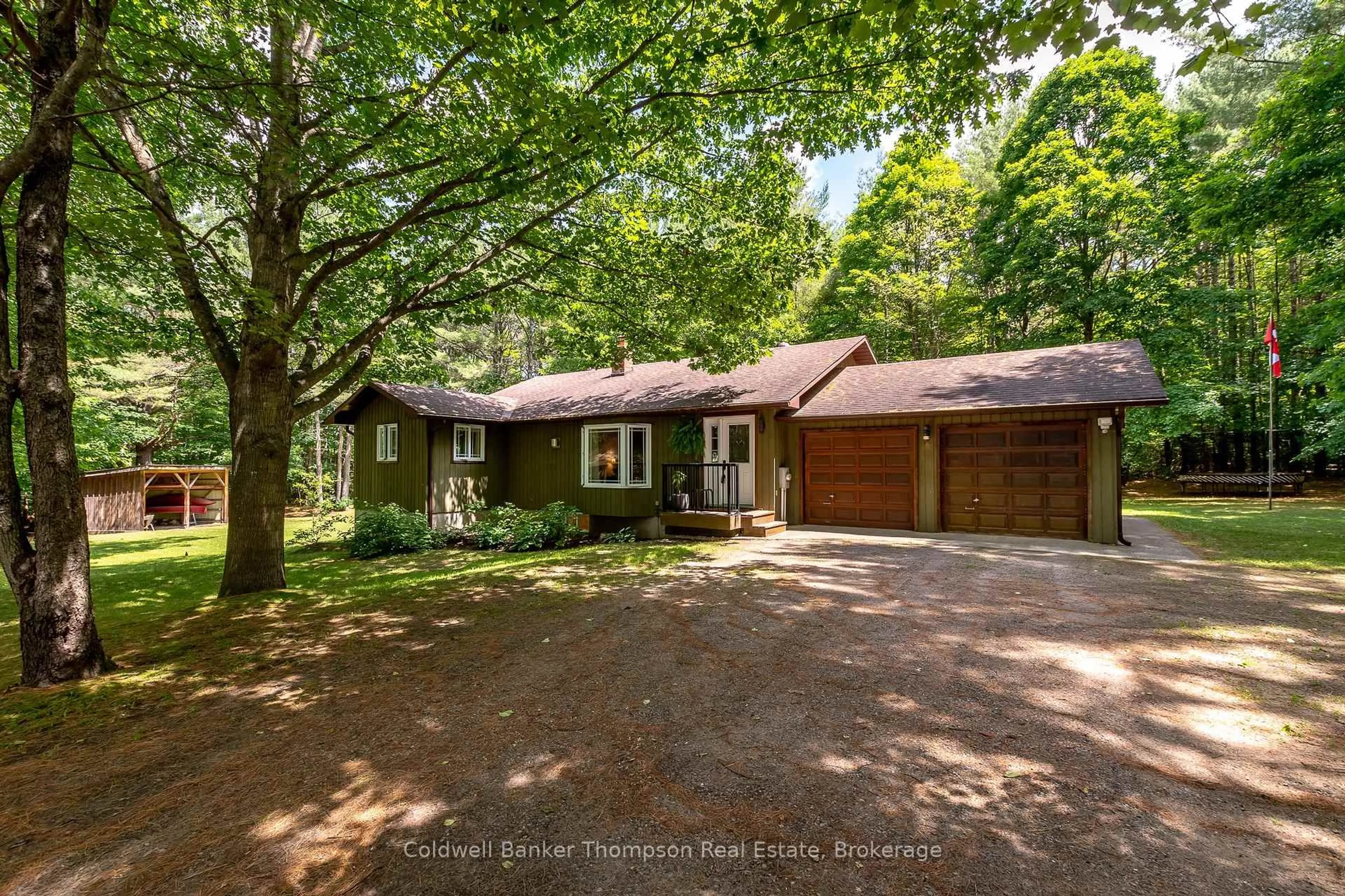 A pic from outside/outdoor area/front of a property/back of a property/a pic from drone, forest/trees view for 549 Greer Rd, Huntsville Ontario P0B 1M0