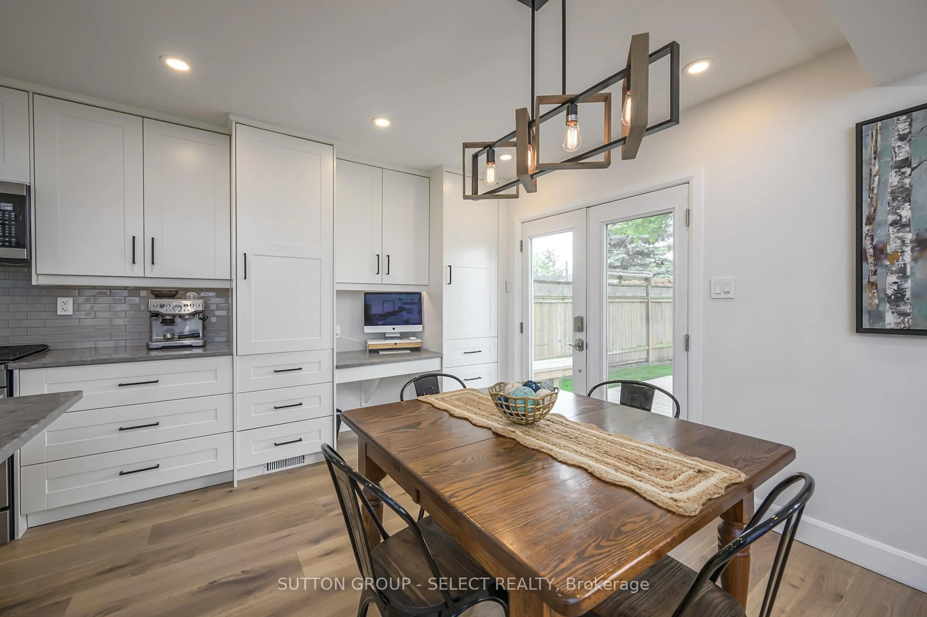Open concept kitchen, wood/laminate floor for 83 Erica Cres, London South Ontario N6E 3P5