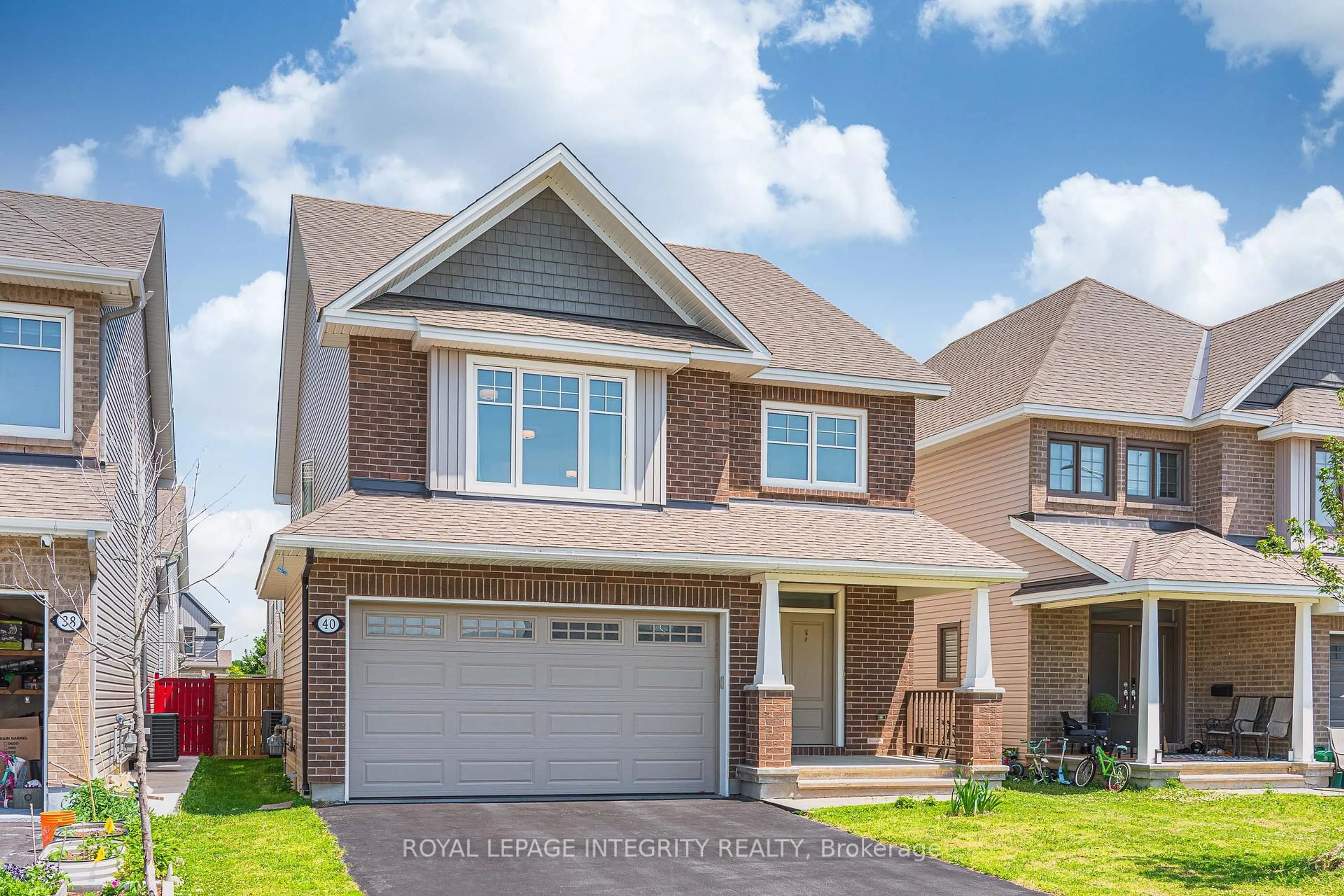 Home with brick exterior material, street for 40 Aconitum Way, Ottawa Ontario K1T 0R8