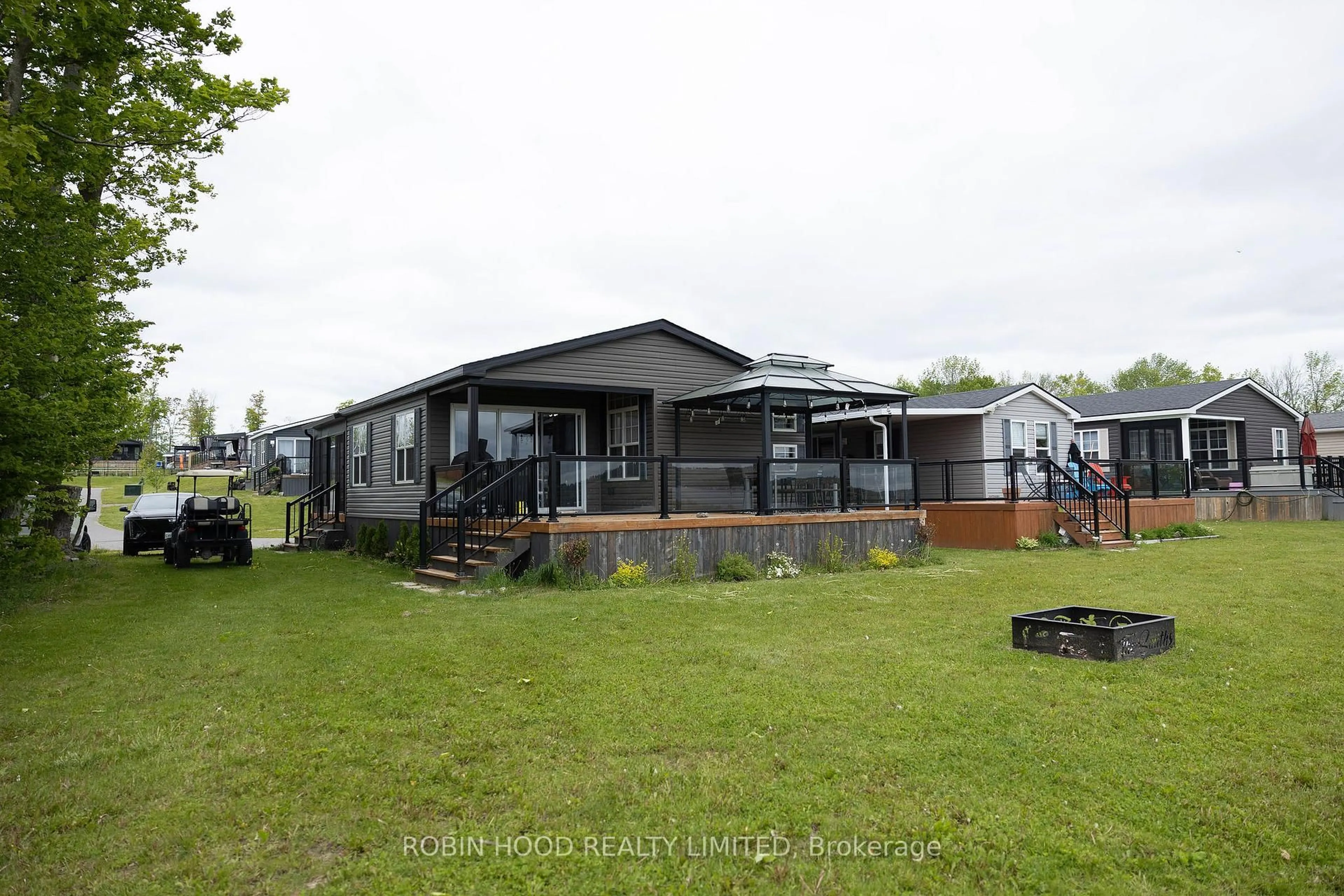 A pic from outside/outdoor area/front of a property/back of a property/a pic from drone, water/lake/river/ocean view for 1235 Villiers Line #12 Islemere, Otonabee-South Monaghan Ontario K0L 1Y0