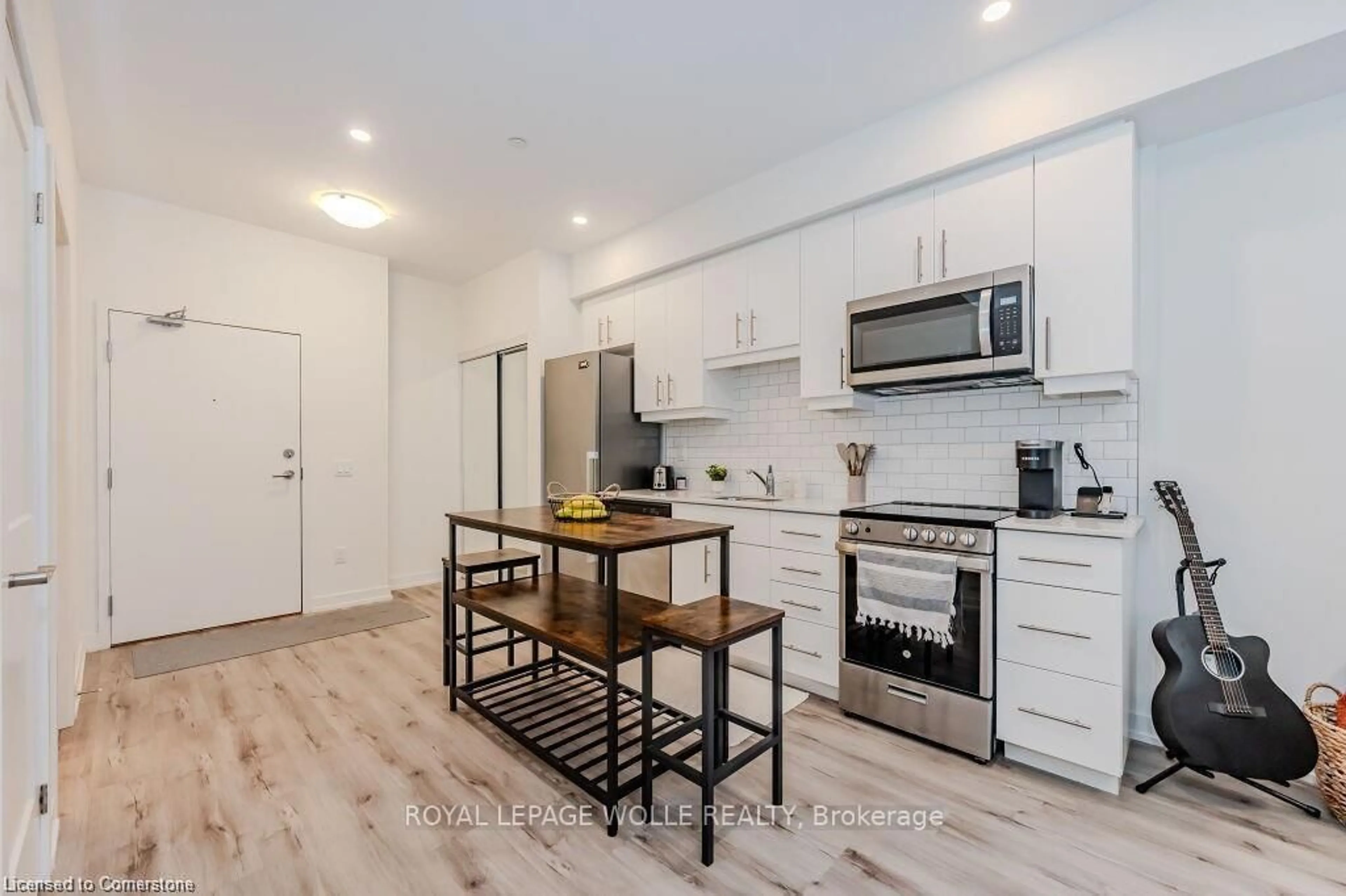 Open concept kitchen, wood/laminate floor for 247 Northfield Dr #410, Waterloo Ontario N2K 0H1