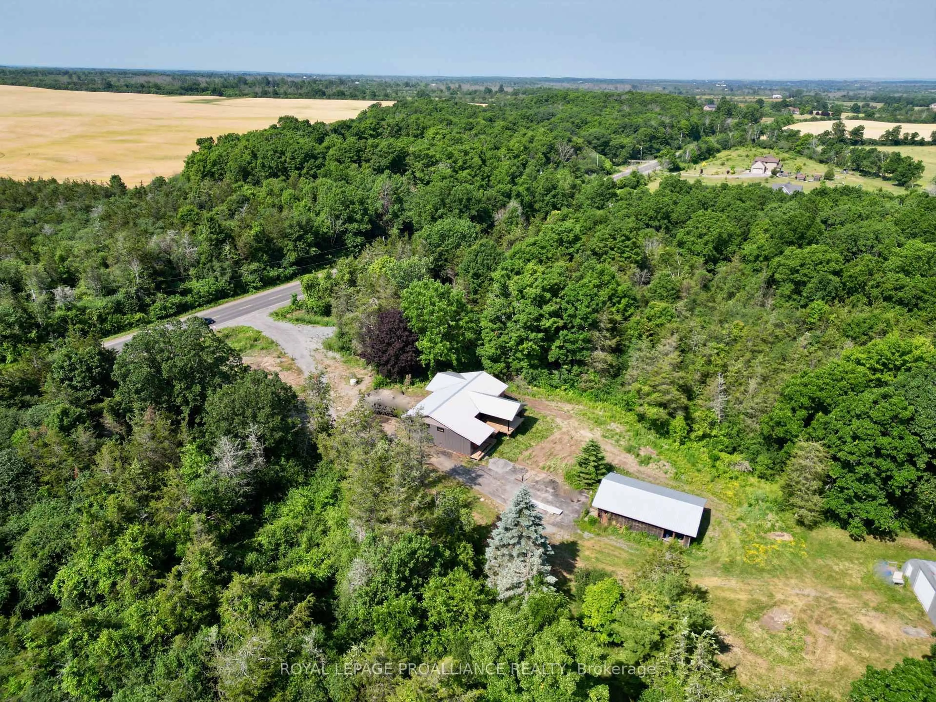 A pic from outside/outdoor area/front of a property/back of a property/a pic from drone, forest/trees view for 3628 County Road 1, Prince Edward County Ontario K7G 2V6