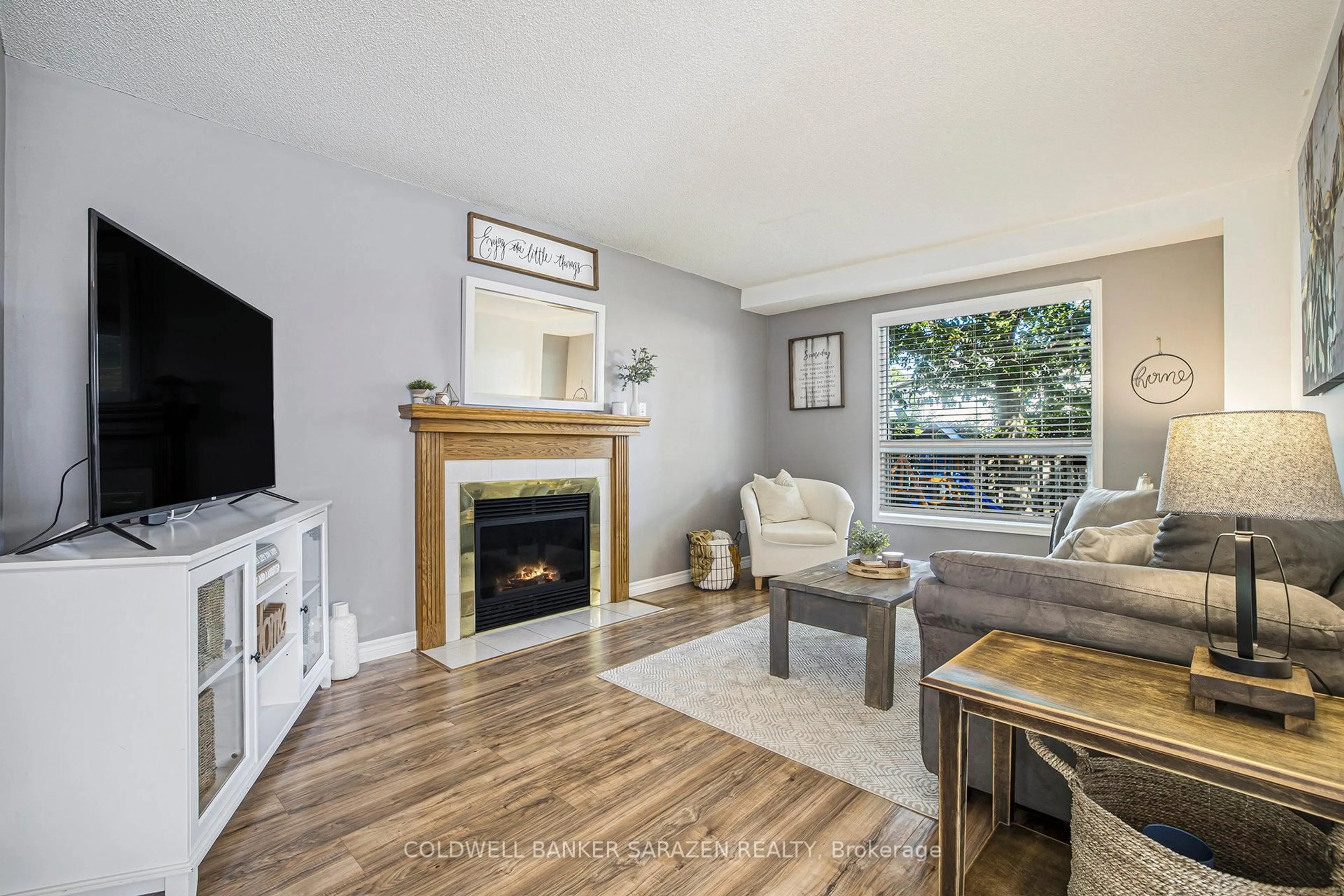 Living room with furniture, wood/laminate floor for 10 Fairview Cres, Arnprior Ontario K7S 3V7