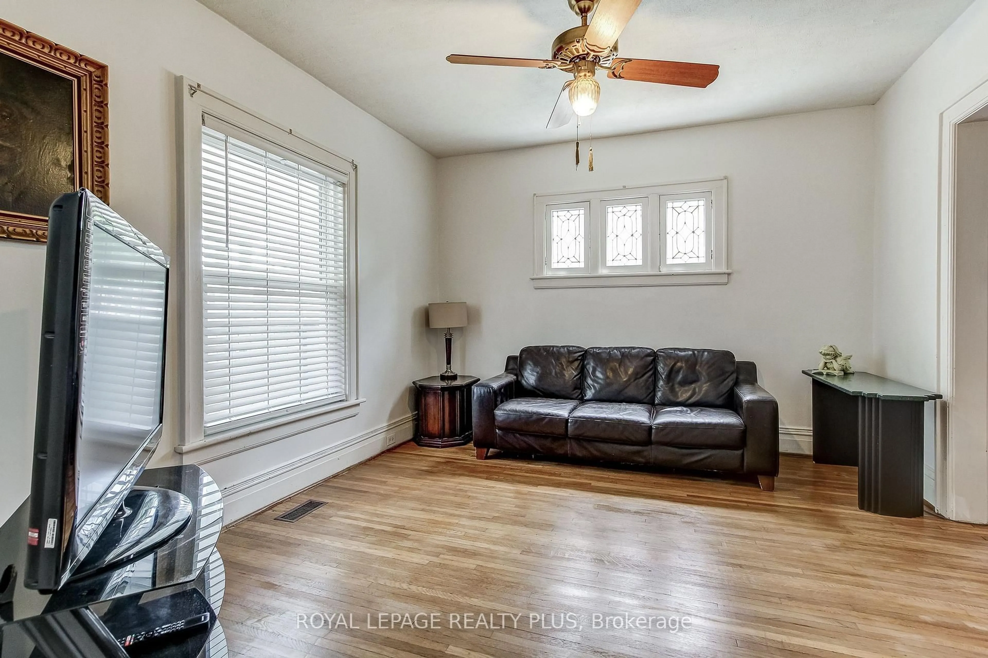 Living room with furniture, wood/laminate floor for 6062 Barker St, Niagara Falls Ontario L2G 1Y4