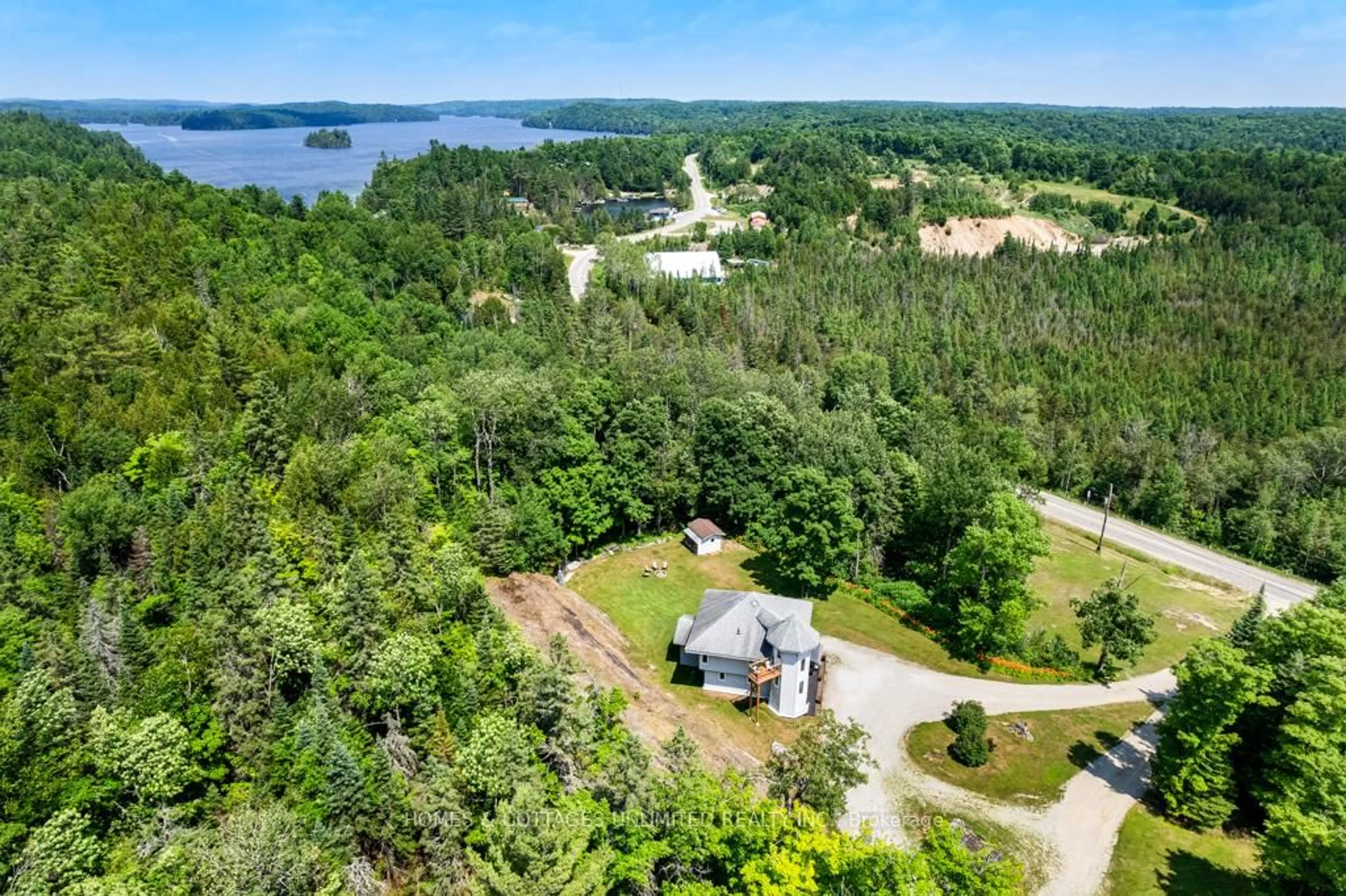 A pic from outside/outdoor area/front of a property/back of a property/a pic from drone, water/lake/river/ocean view for 9537 509 Highway, Ompah Ontario K0H 2J0