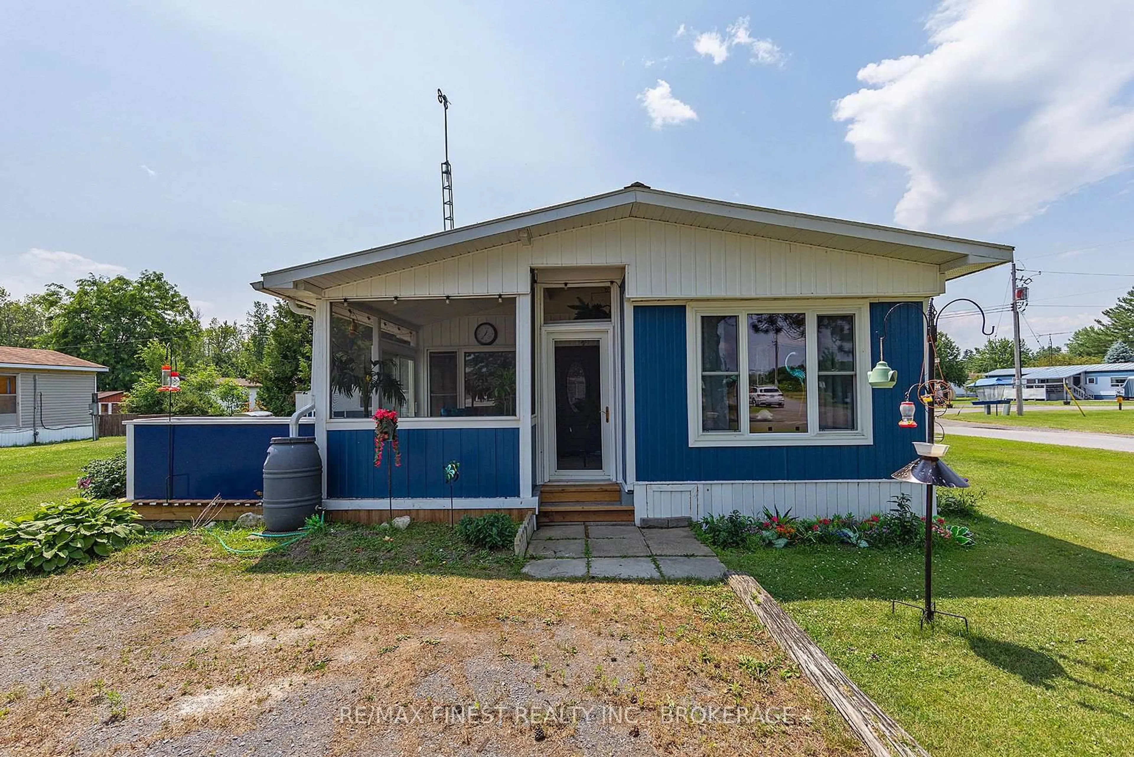 Home with vinyl exterior material, street for 4327 Elm St, South Frontenac Ontario K0K 2W0