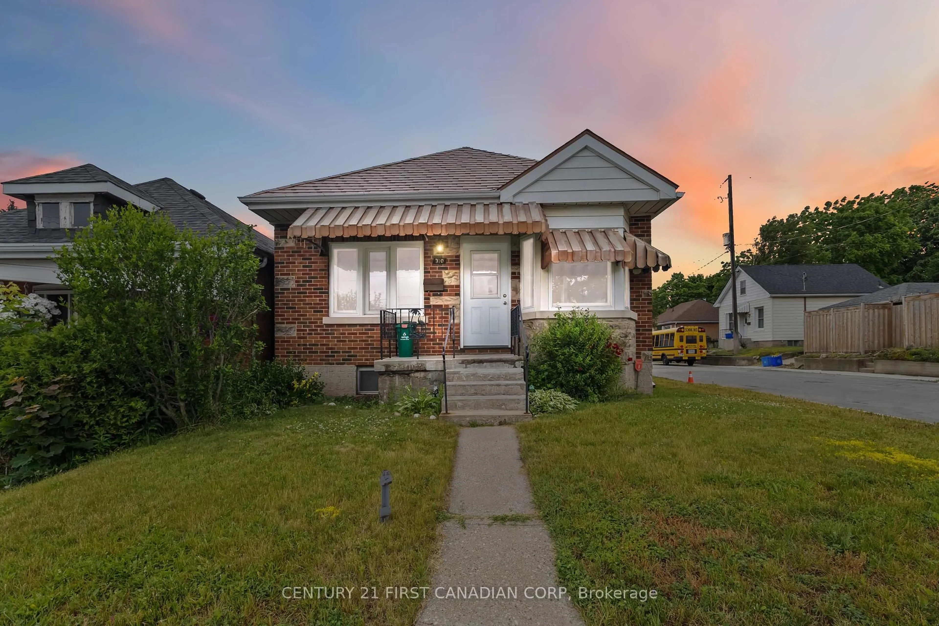 Home with brick exterior material, street for 310 St Paul Ave, Brantford Ontario N3R 4M8