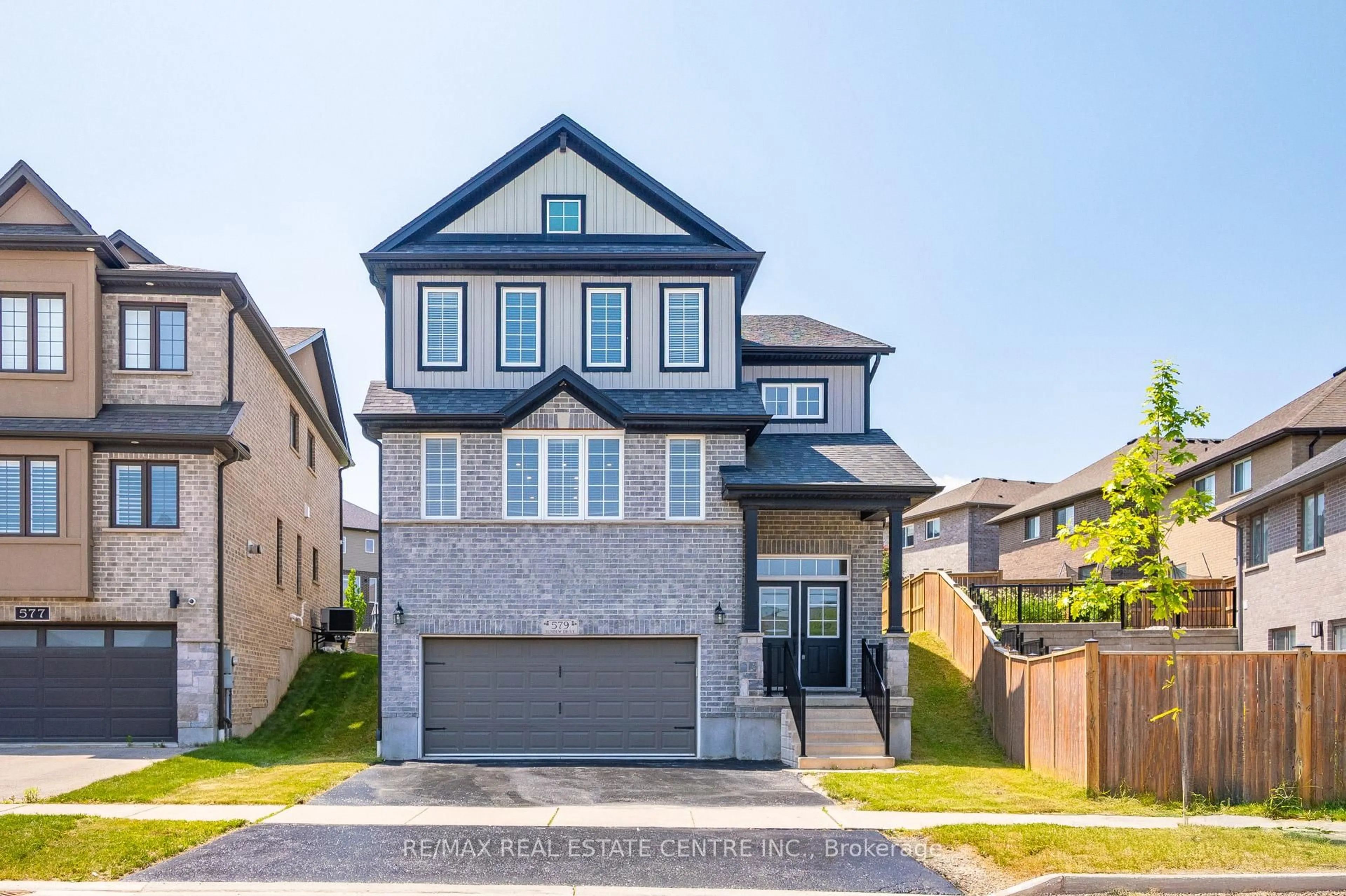 Home with brick exterior material, street for 579 SUNDEW Dr, Waterloo Ontario N2V 0B9