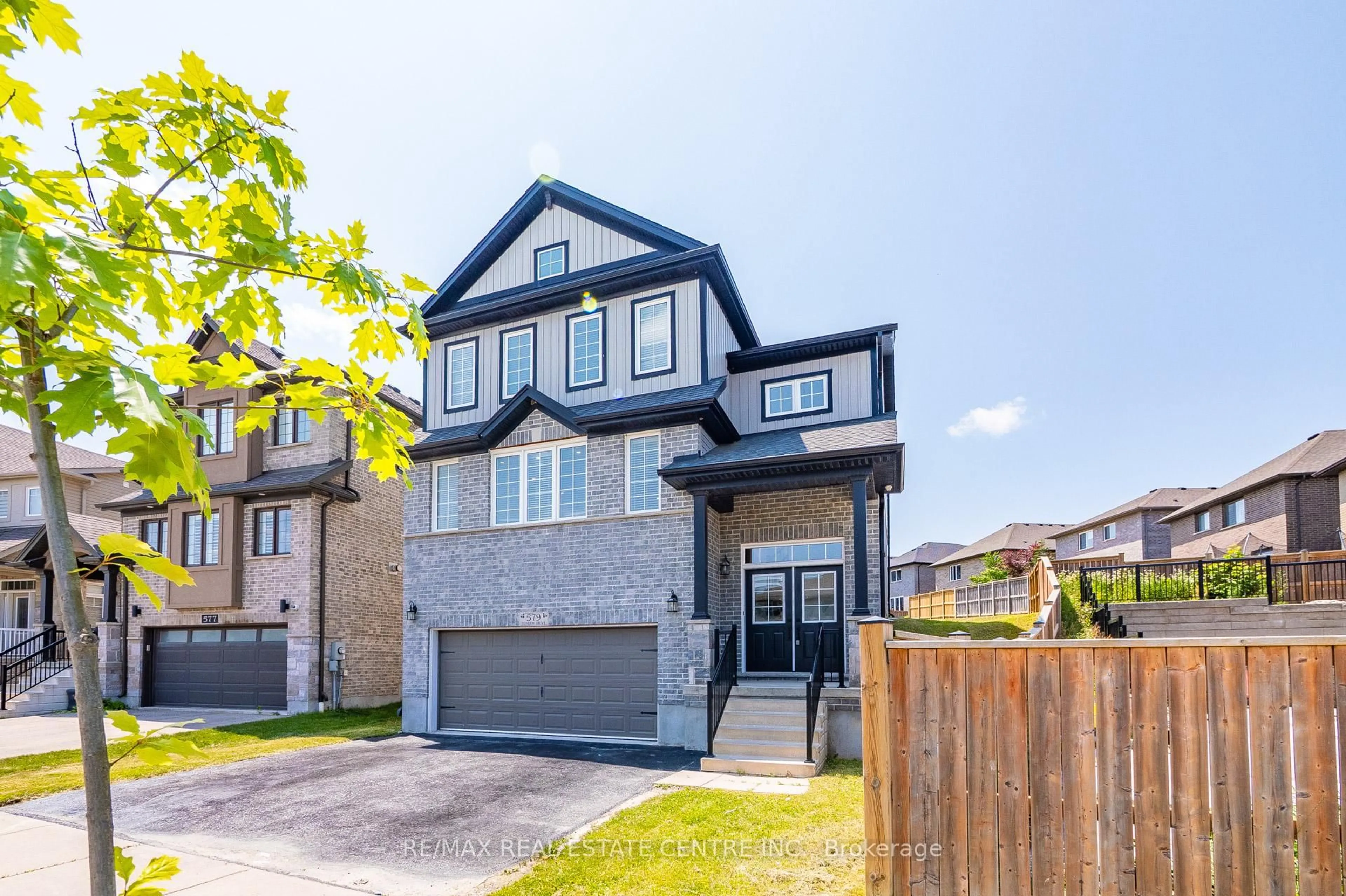 Home with brick exterior material, street for 579 SUNDEW Dr, Waterloo Ontario N2V 0B9