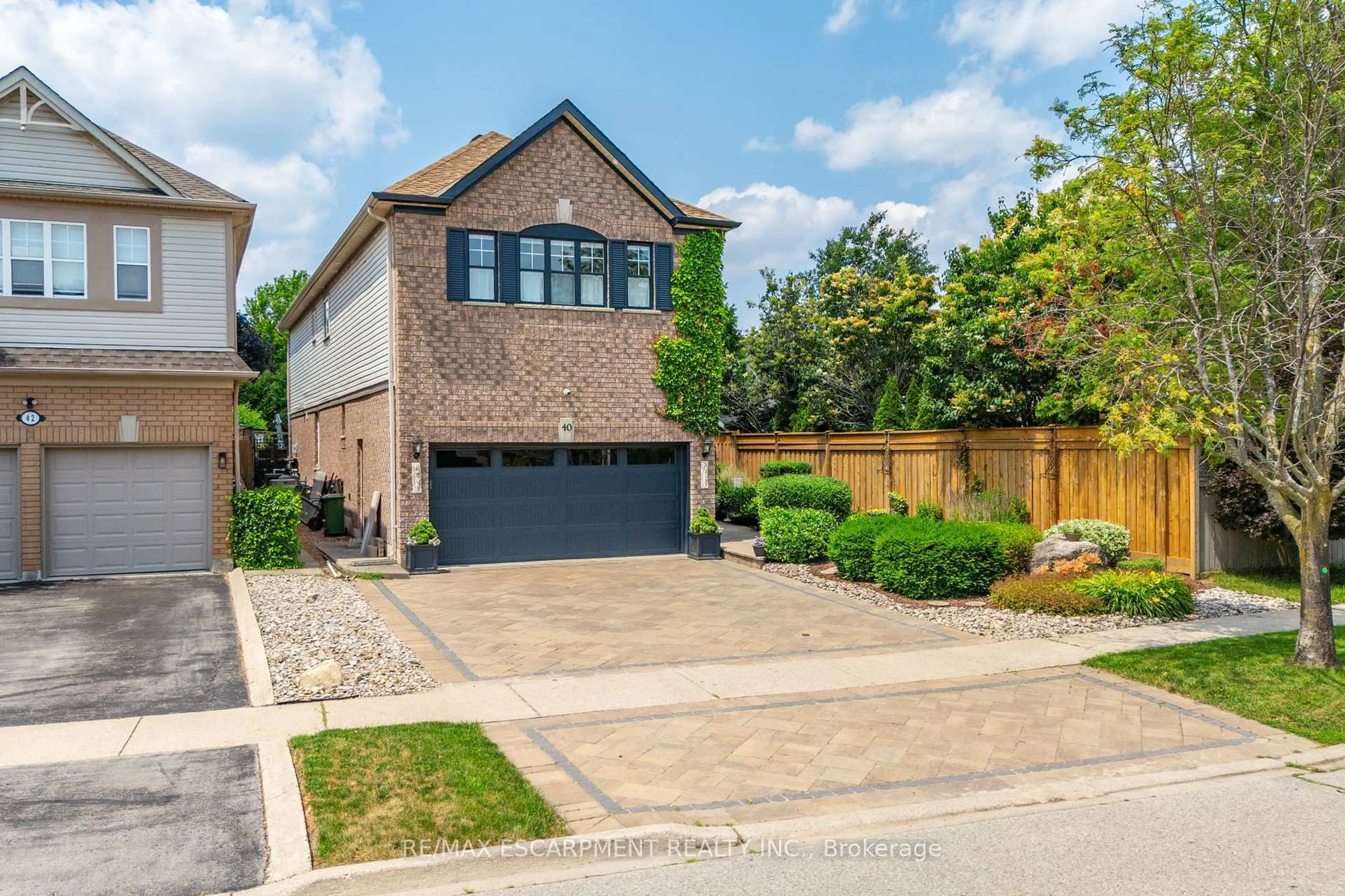 Home with brick exterior material, street for 40 Premier Rd, Hamilton Ontario L8B 0K7