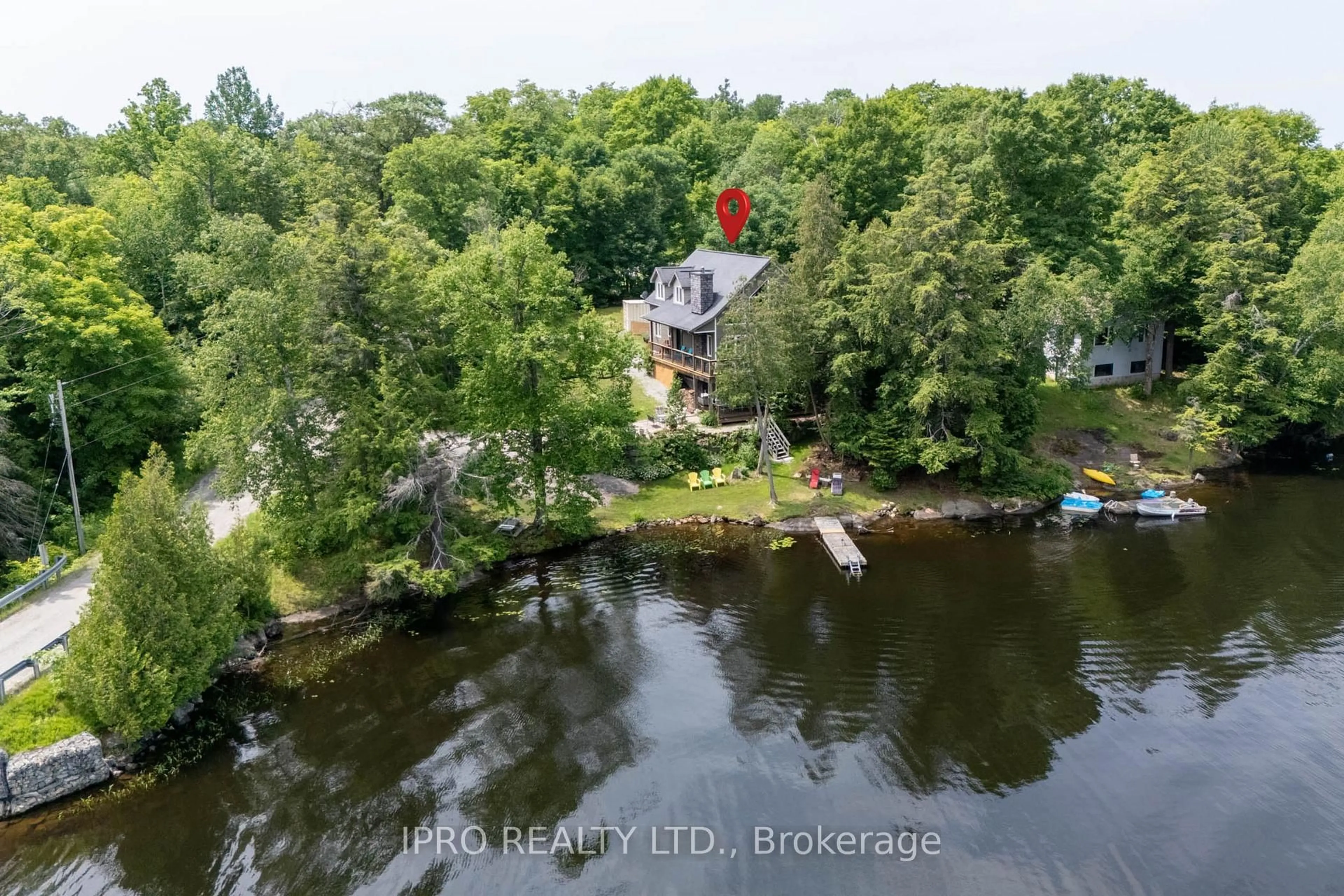A pic from outside/outdoor area/front of a property/back of a property/a pic from drone, water/lake/river/ocean view for 1 Mckowen Rd, McKellar Ontario P0G 1C0