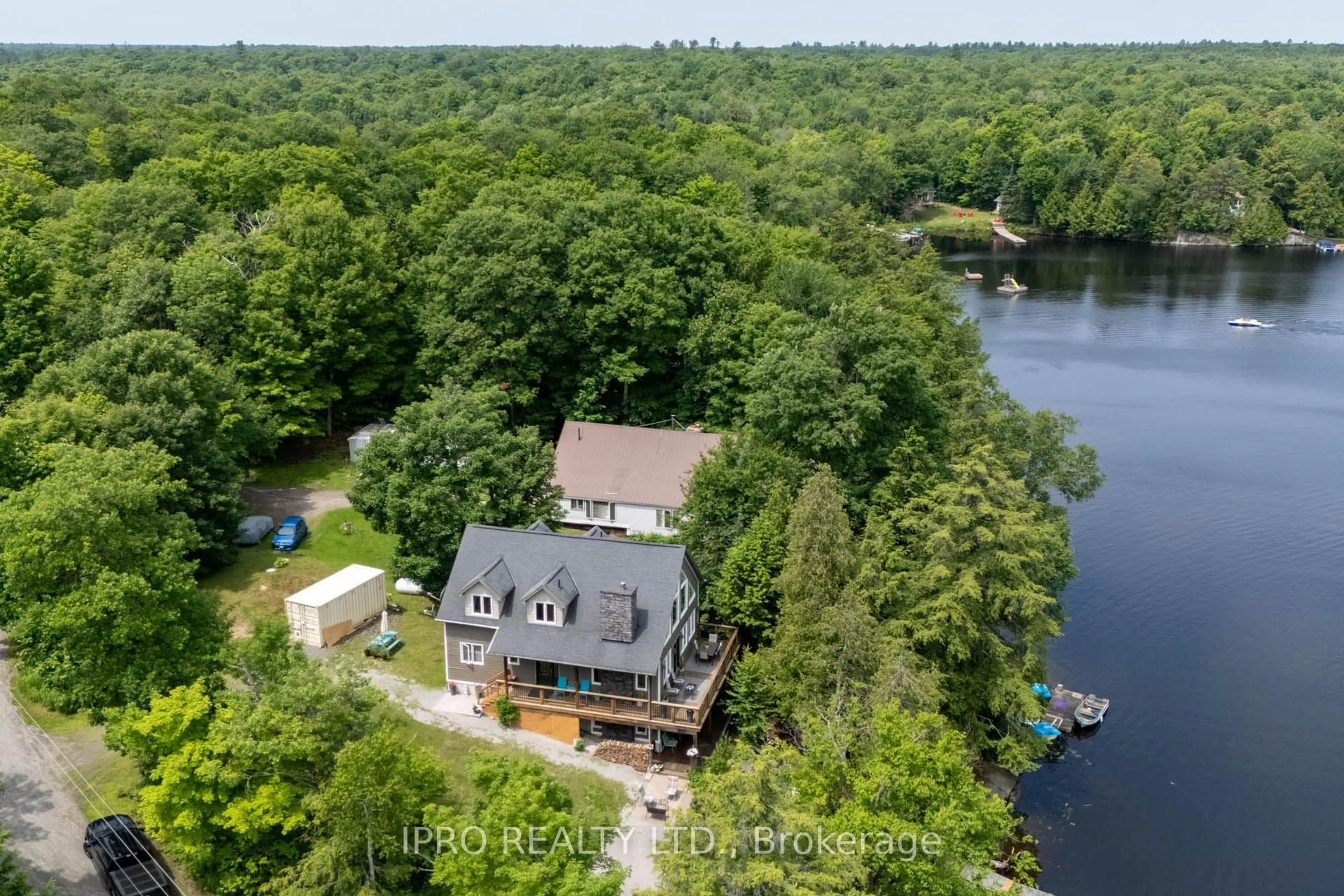 A pic from outside/outdoor area/front of a property/back of a property/a pic from drone, water/lake/river/ocean view for 1 Mckowen Rd, McKellar Ontario P0G 1C0
