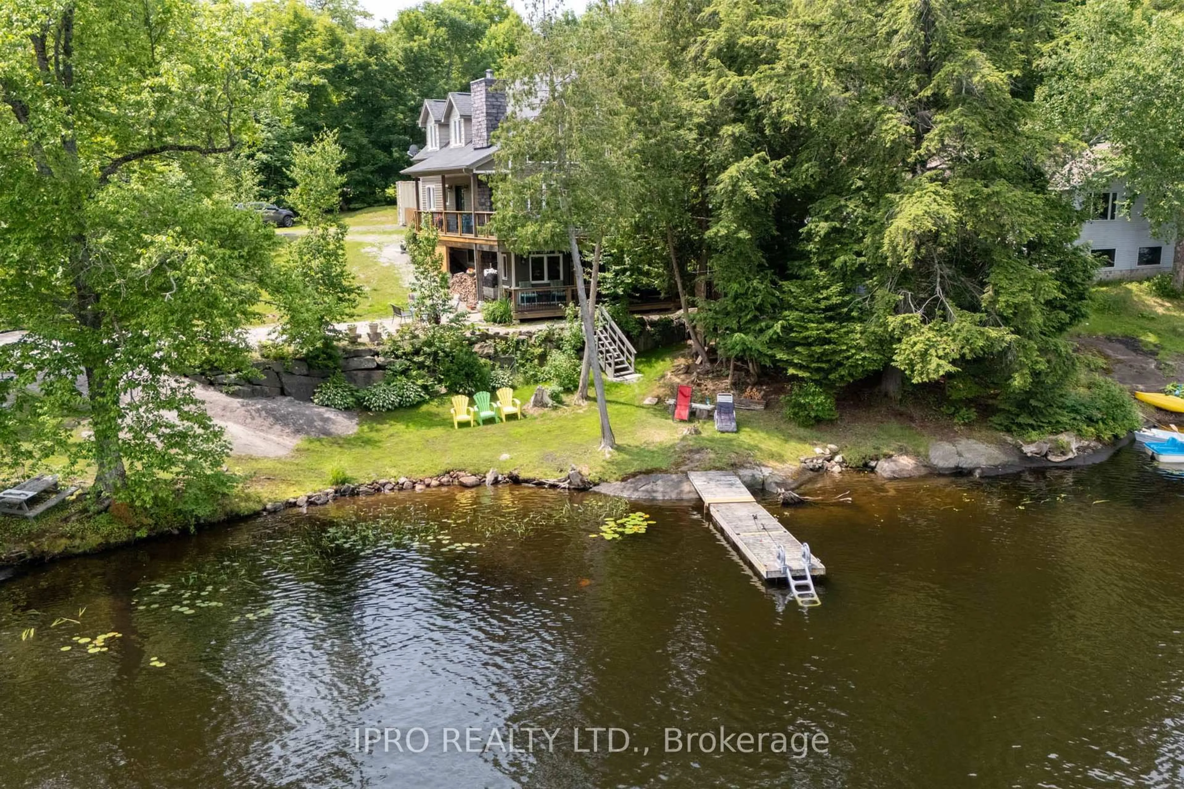 A pic from outside/outdoor area/front of a property/back of a property/a pic from drone, water/lake/river/ocean view for 1 Mckowen Rd, McKellar Ontario P0G 1C0