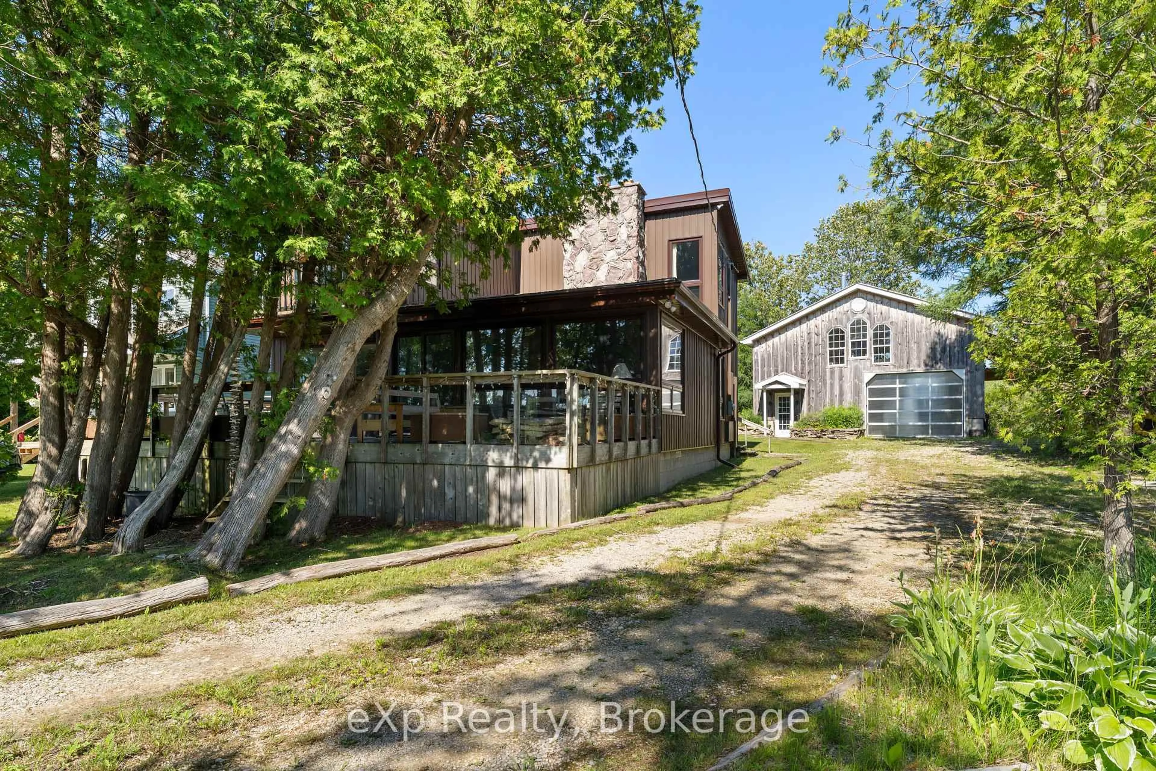 A pic from outside/outdoor area/front of a property/back of a property/a pic from drone, street for 329 Bay St, South Bruce Peninsula Ontario N0H 2T0
