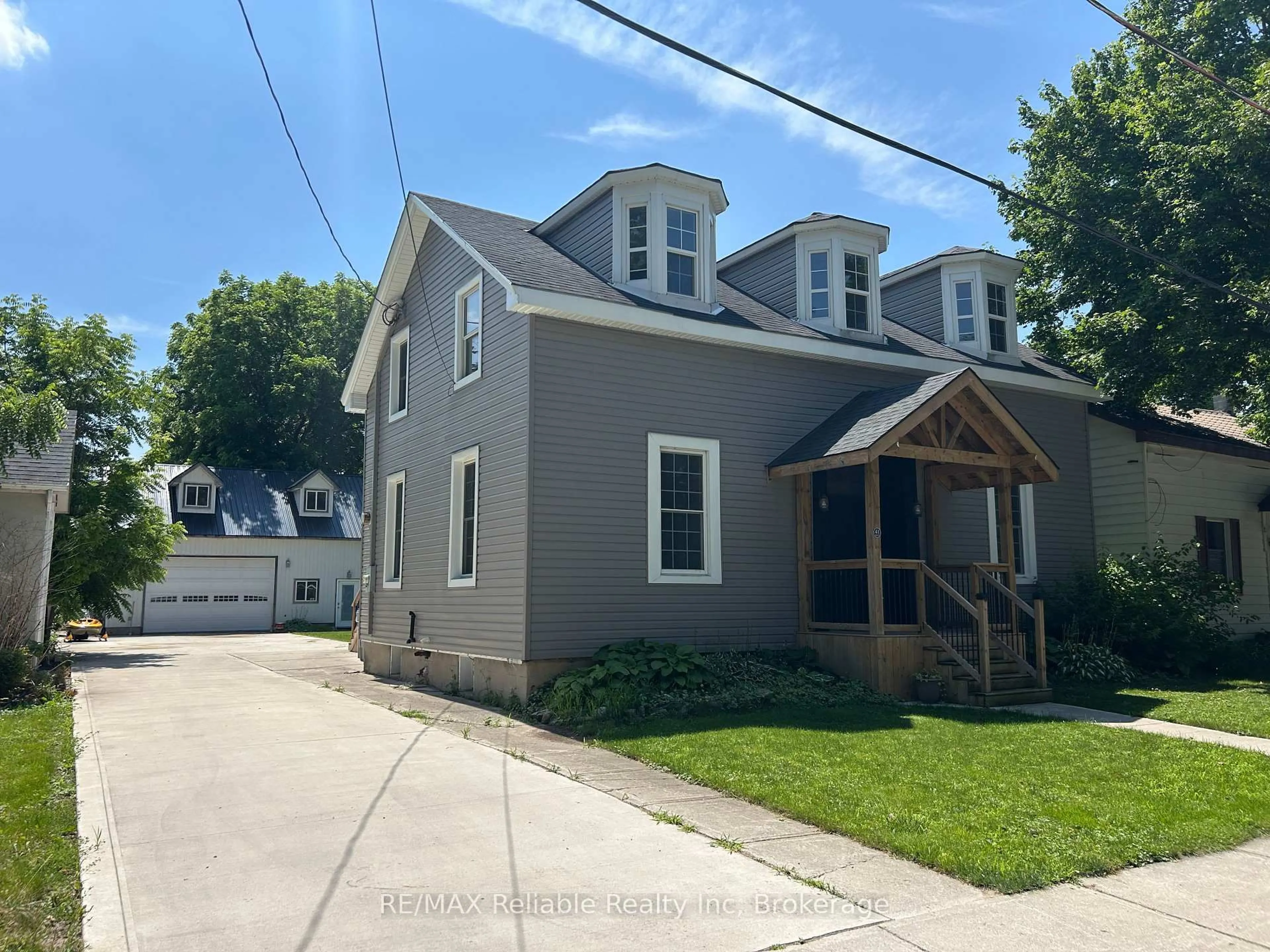 Home with vinyl exterior material, street for 41 John St, Huron East Ontario N0K 1W0