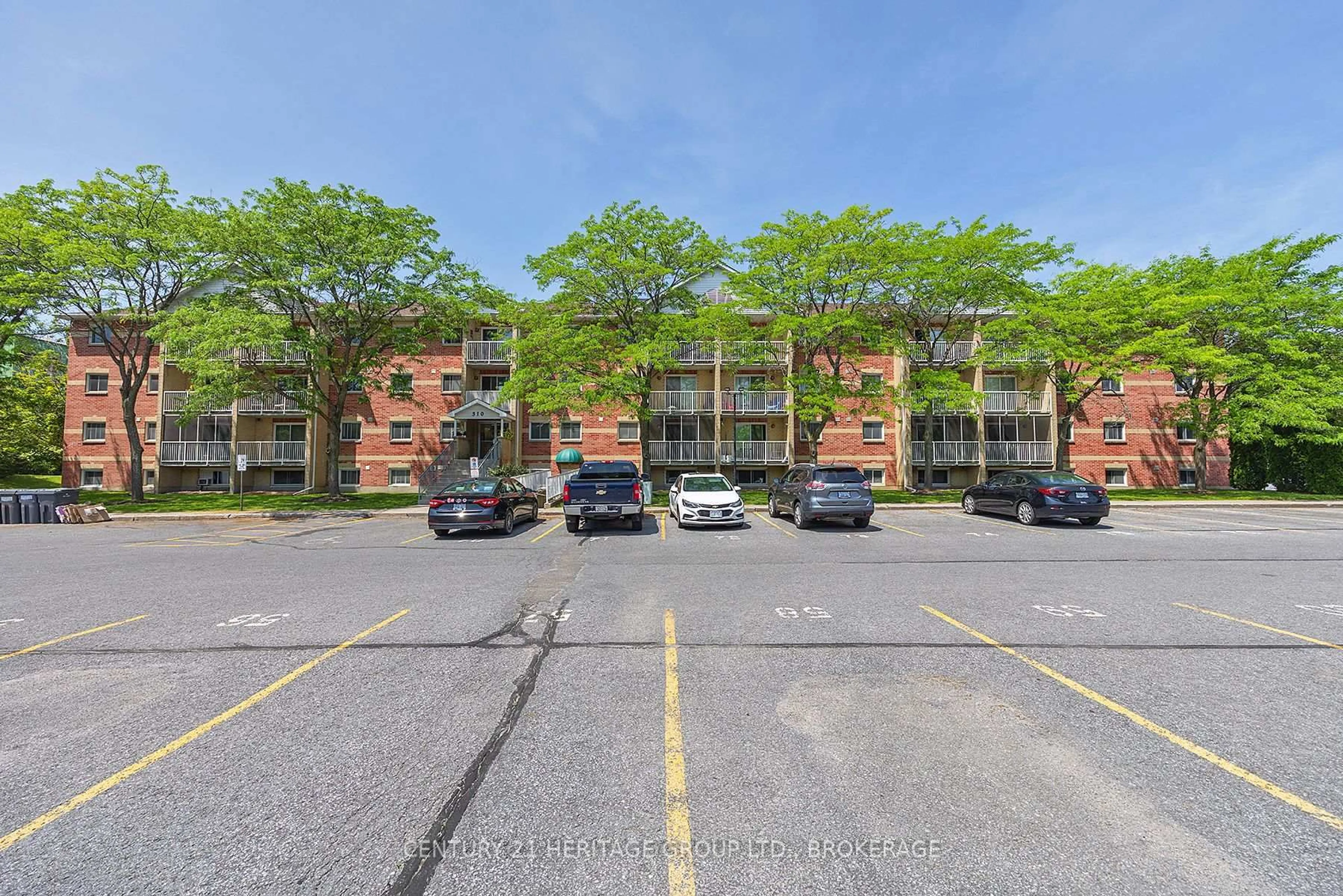 A pic from outside/outdoor area/front of a property/back of a property/a pic from drone, street for 310 Kingsdale Ave #107, Kingston Ontario K7M 8S1