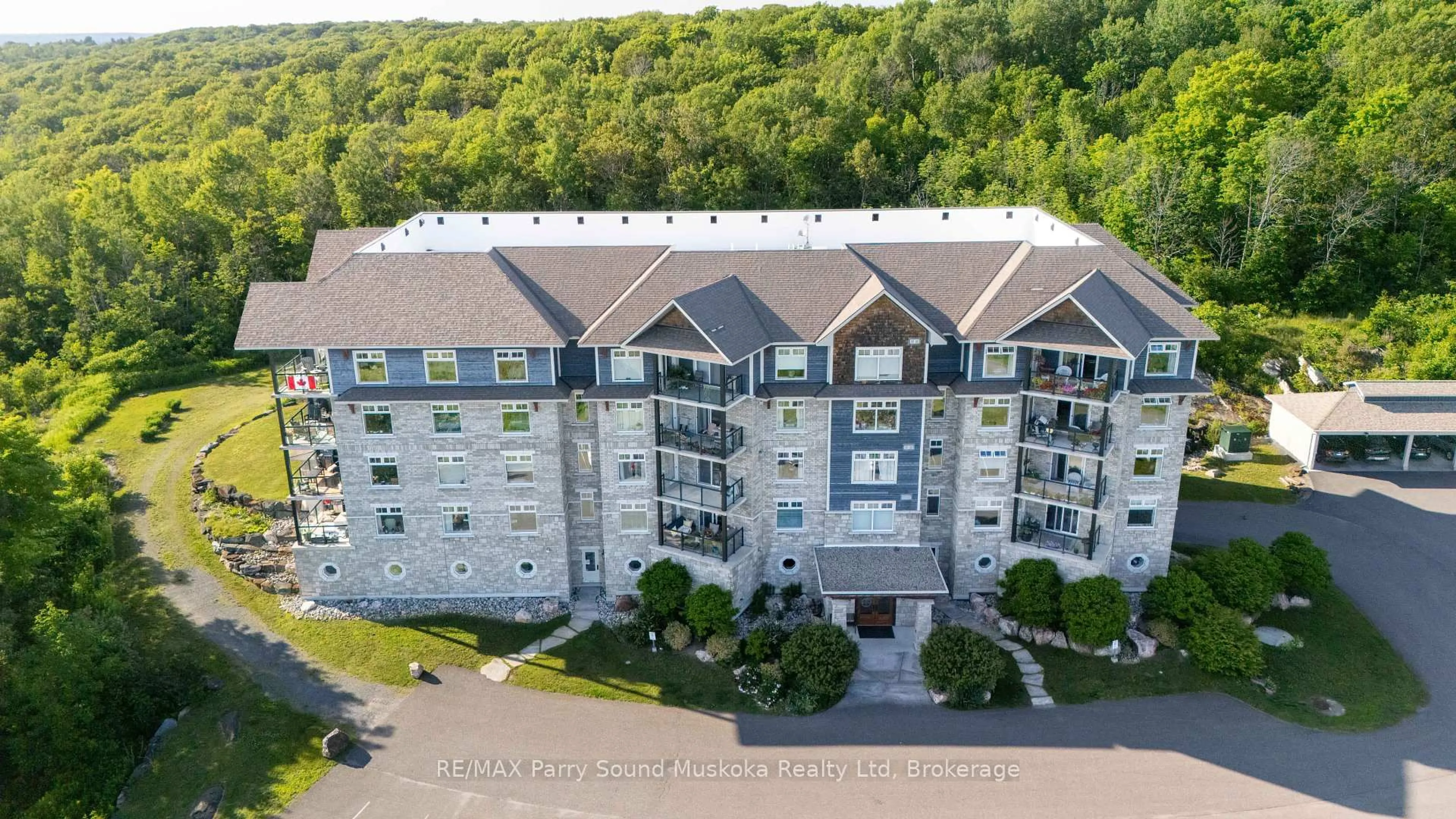 A pic from outside/outdoor area/front of a property/back of a property/a pic from drone, building for 11A Salt Dock Rd #104, Parry Sound Ontario P2A 3B6