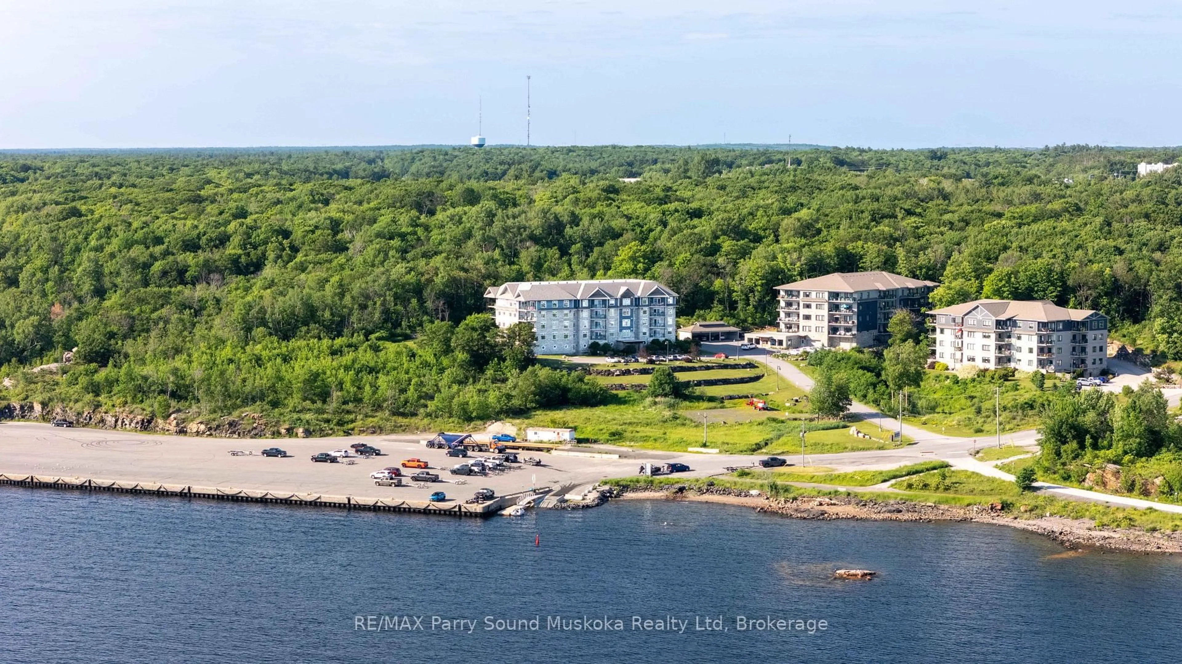 A pic from outside/outdoor area/front of a property/back of a property/a pic from drone, water/lake/river/ocean view for 11A Salt Dock Rd #104, Parry Sound Ontario P2A 3B6