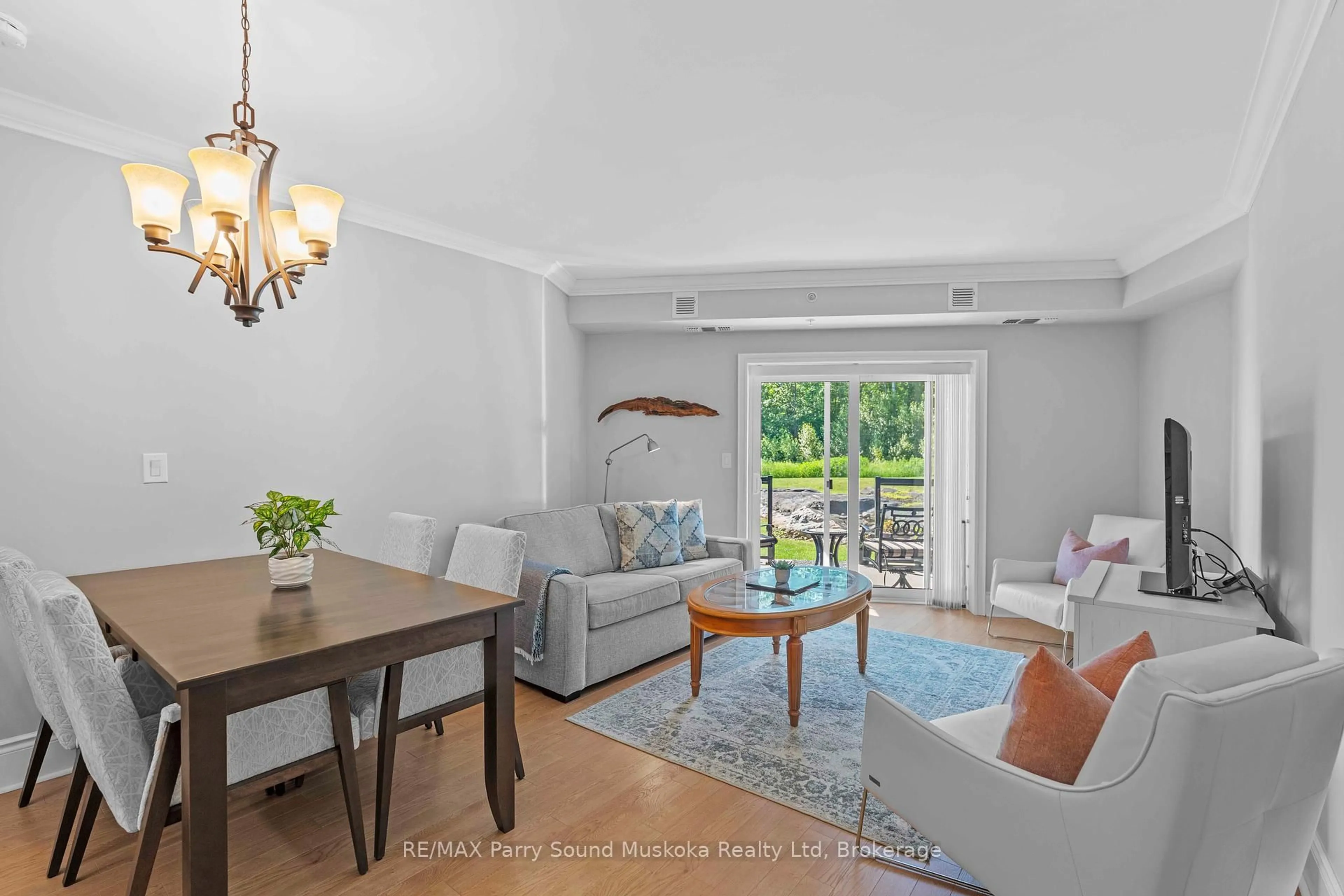 Living room with furniture, wood/laminate floor for 11A Salt Dock Rd #104, Parry Sound Ontario P2A 3B6