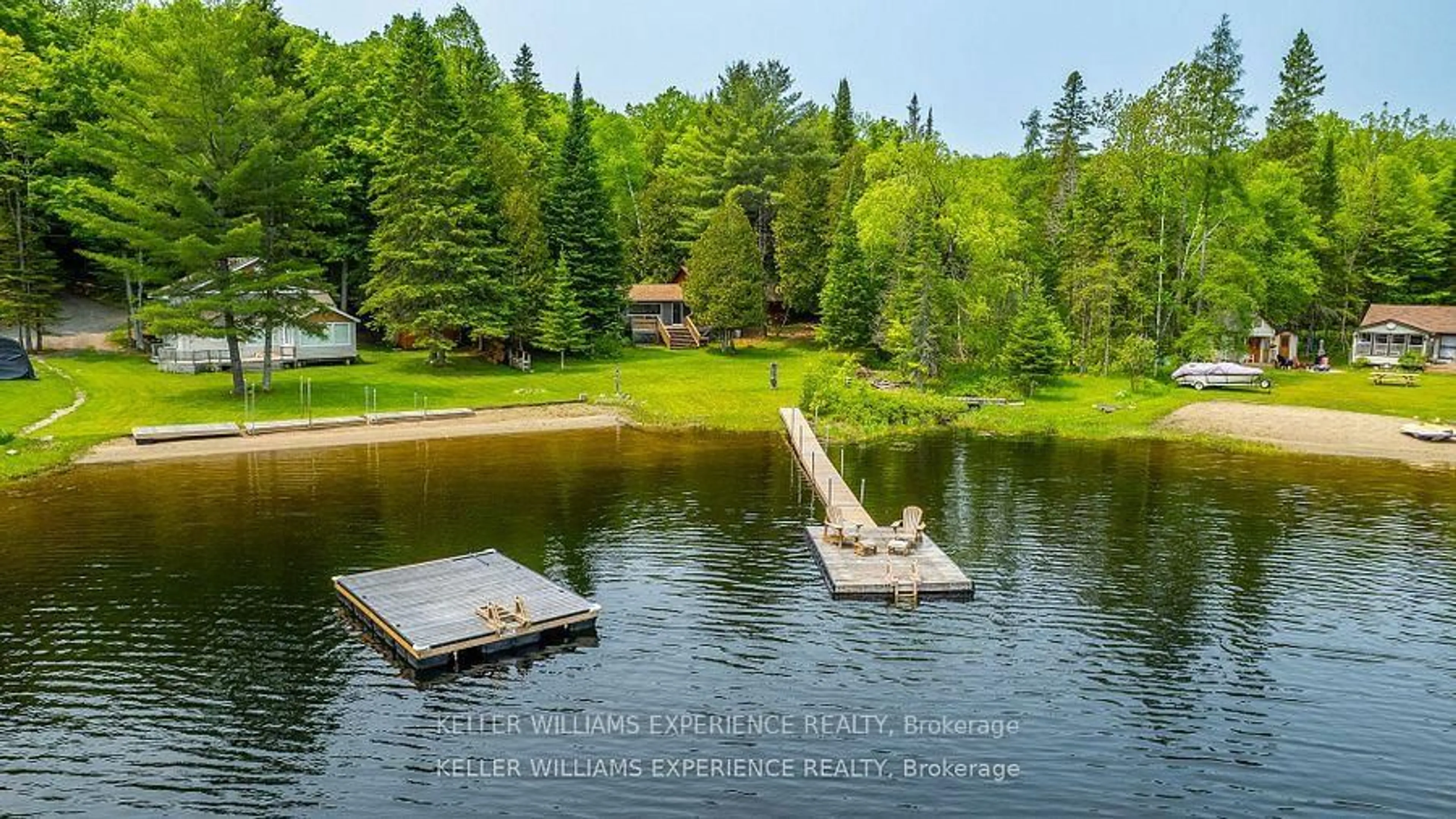 A pic from outside/outdoor area/front of a property/back of a property/a pic from drone, water/lake/river/ocean view for 1049 ELSIE BAY Rd, Minden Hills Ontario K0M 2K0