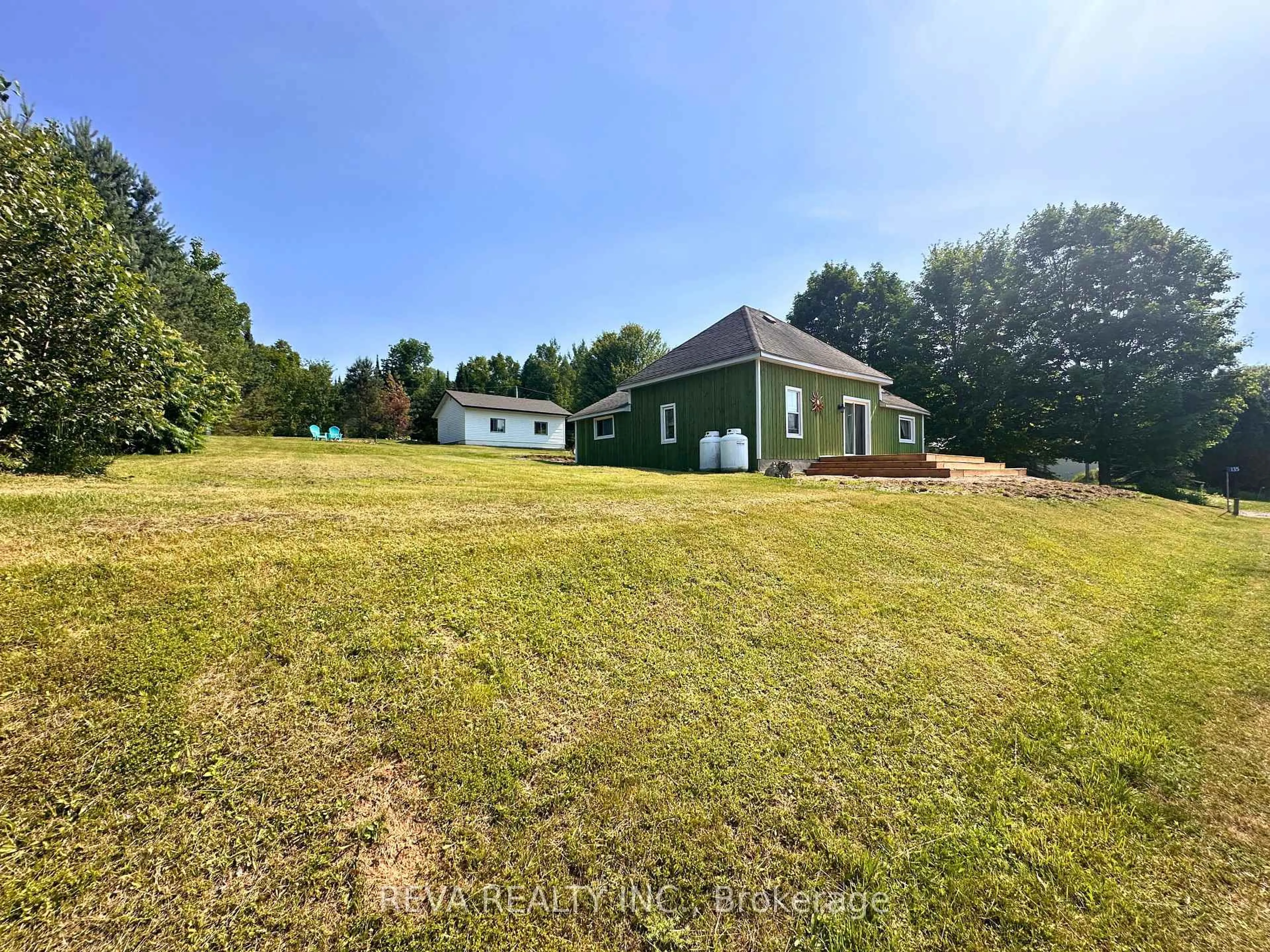 A pic from outside/outdoor area/front of a property/back of a property/a pic from drone, water/lake/river/ocean view for 135 Village Rd, Bancroft Ontario K0L 1C0