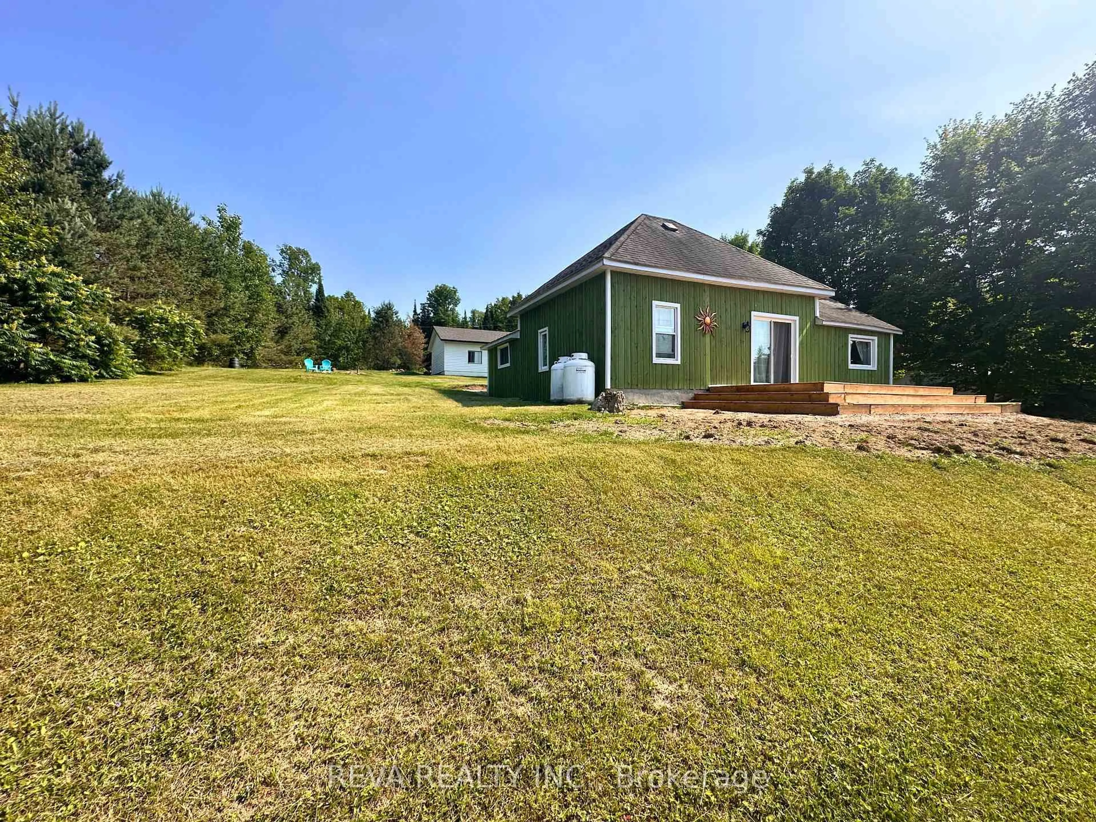 A pic from outside/outdoor area/front of a property/back of a property/a pic from drone, water/lake/river/ocean view for 135 Village Rd, Bancroft Ontario K0L 1C0