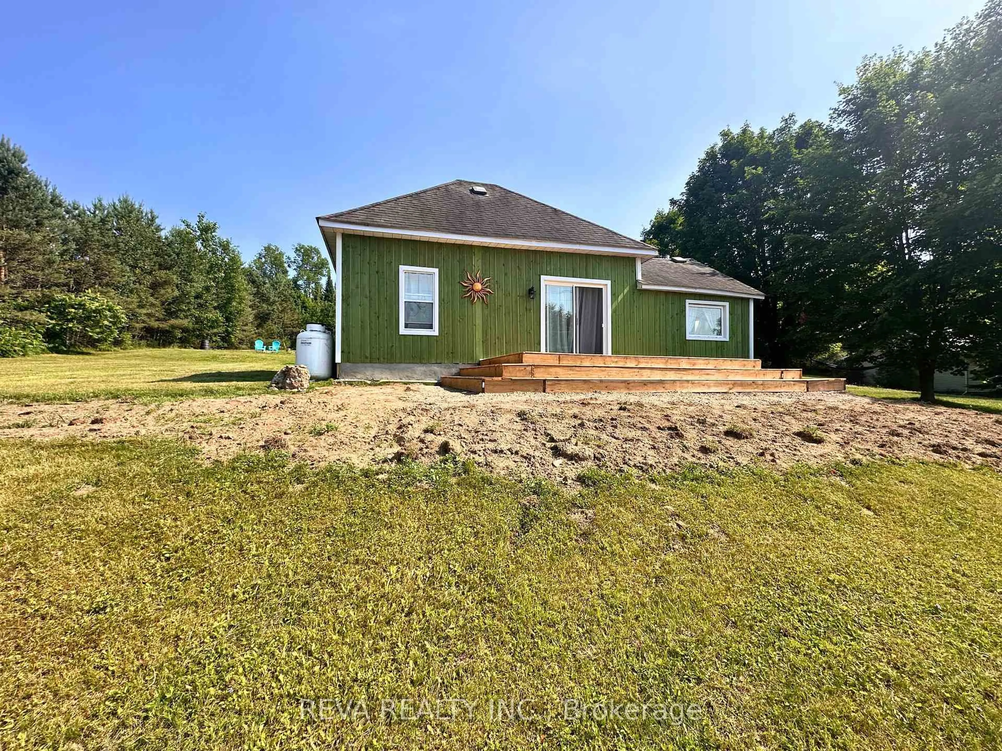 A pic from outside/outdoor area/front of a property/back of a property/a pic from drone, water/lake/river/ocean view for 135 Village Rd, Bancroft Ontario K0L 1C0