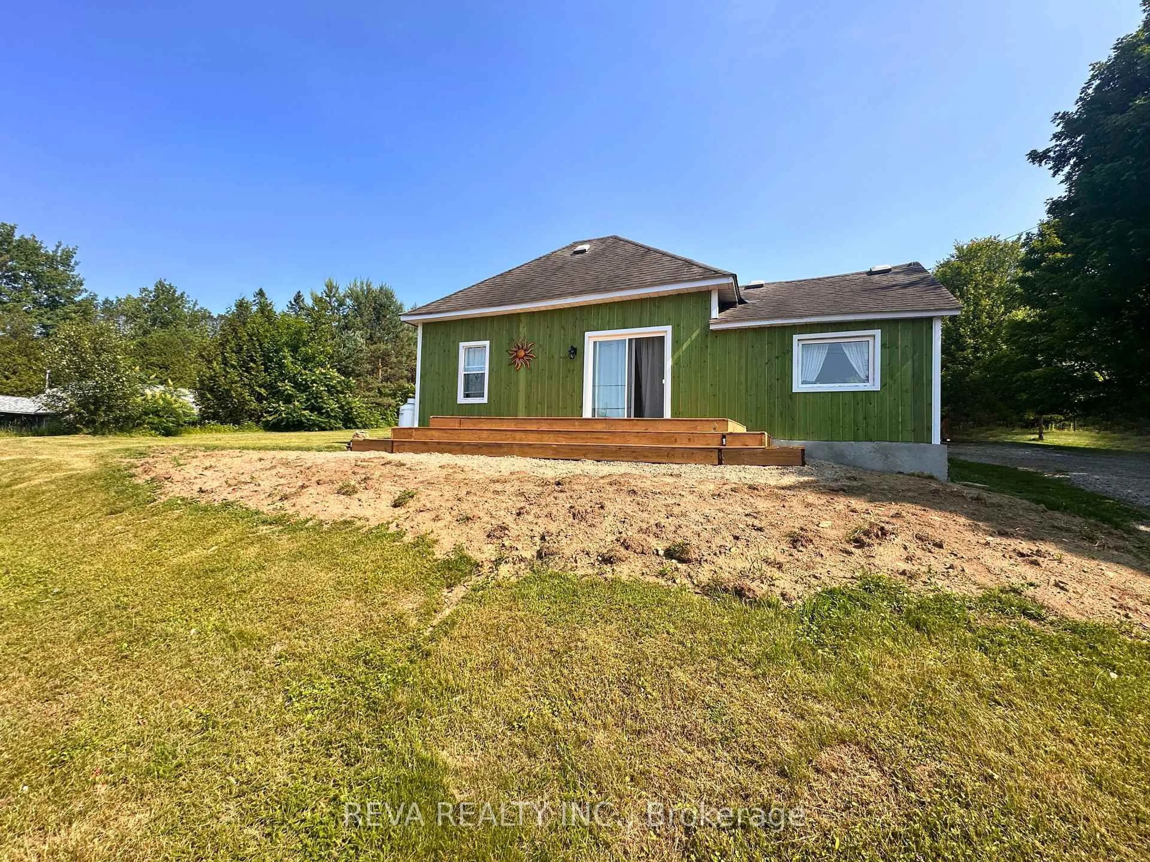 A pic from outside/outdoor area/front of a property/back of a property/a pic from drone, water/lake/river/ocean view for 135 Village Rd, Bancroft Ontario K0L 1C0