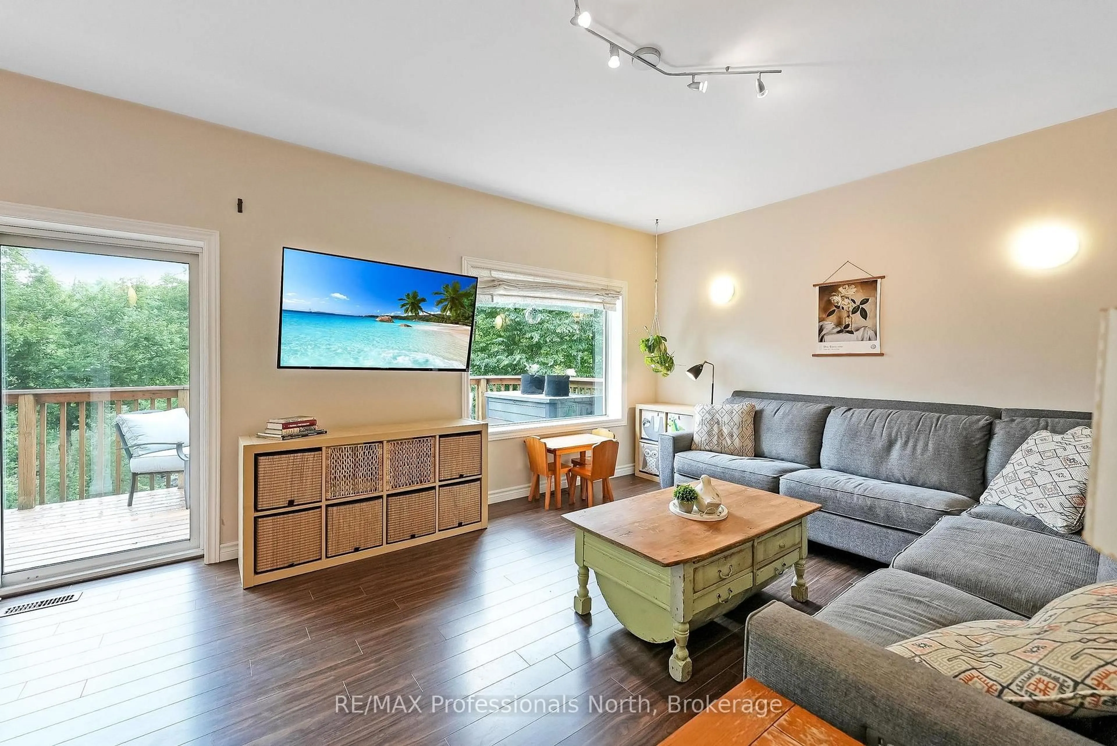 Living room with furniture, wood/laminate floor for 1071 Alton Lane, Minden Hills Ontario K0M 2K0