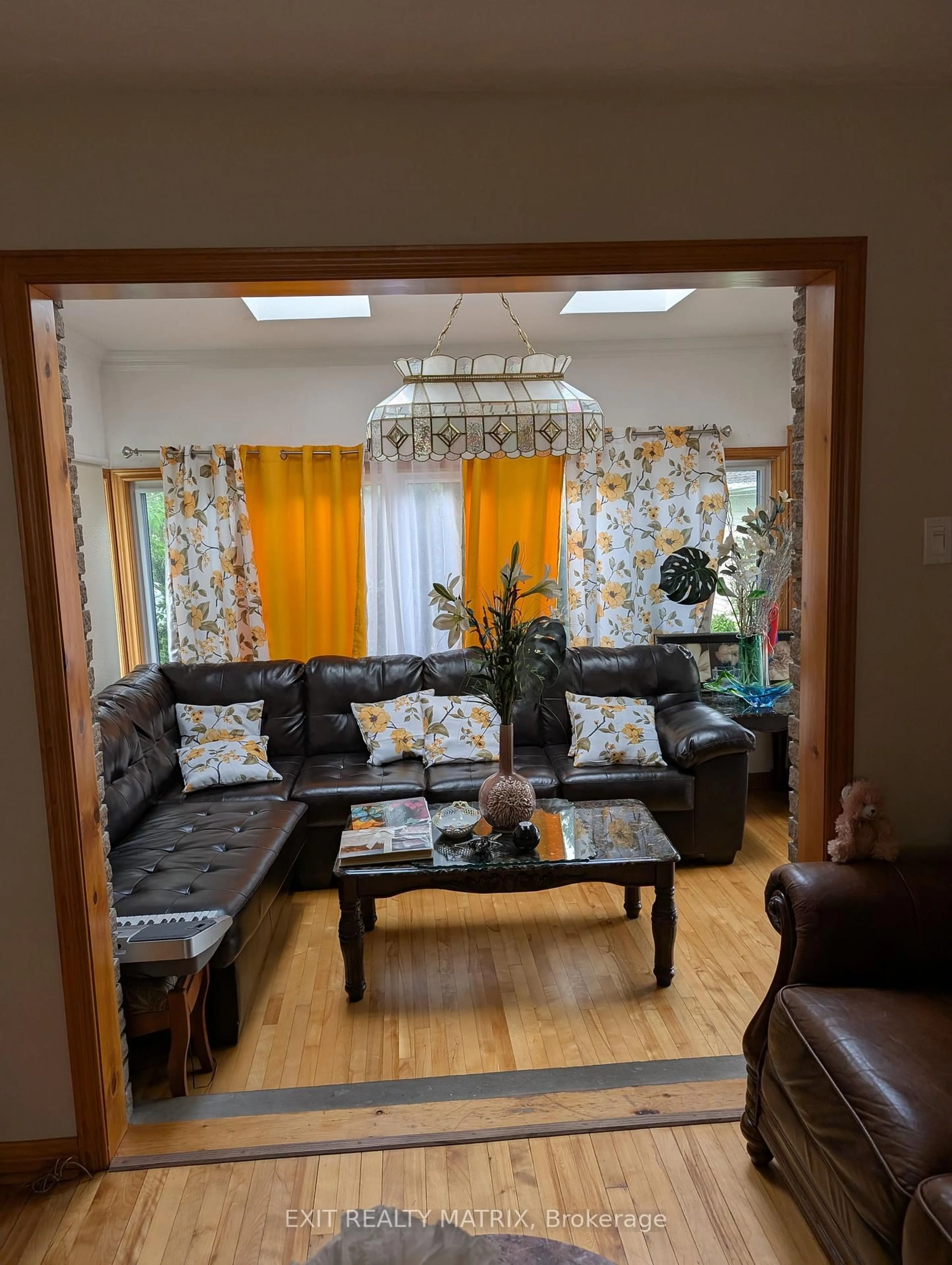 Living room with furniture, wood/laminate floor for 393 Donald St, Ottawa Ontario K1K 1M2