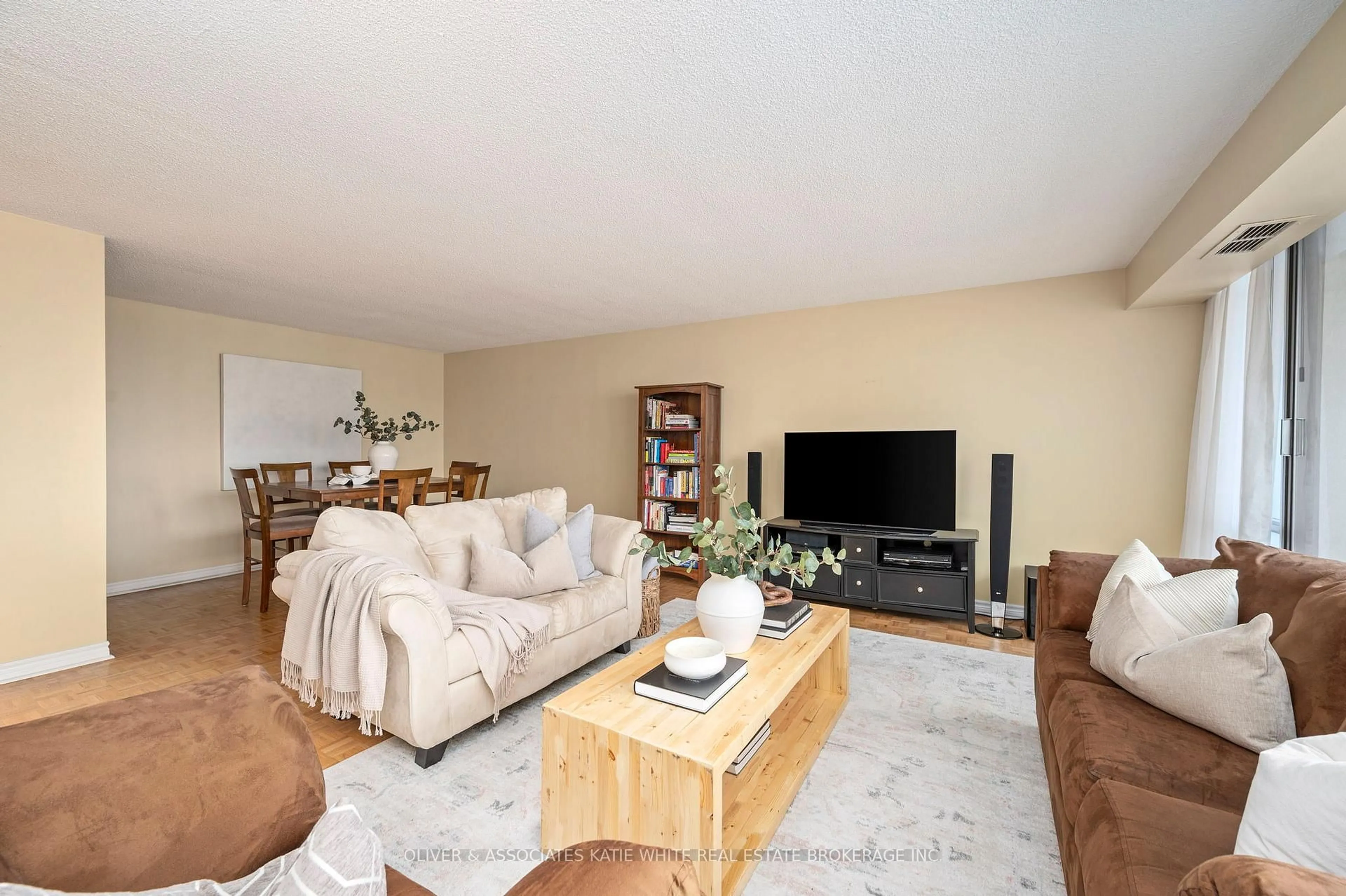Living room with furniture, wood/laminate floor for 380 King St #1507, London East Ontario N6B 3L6