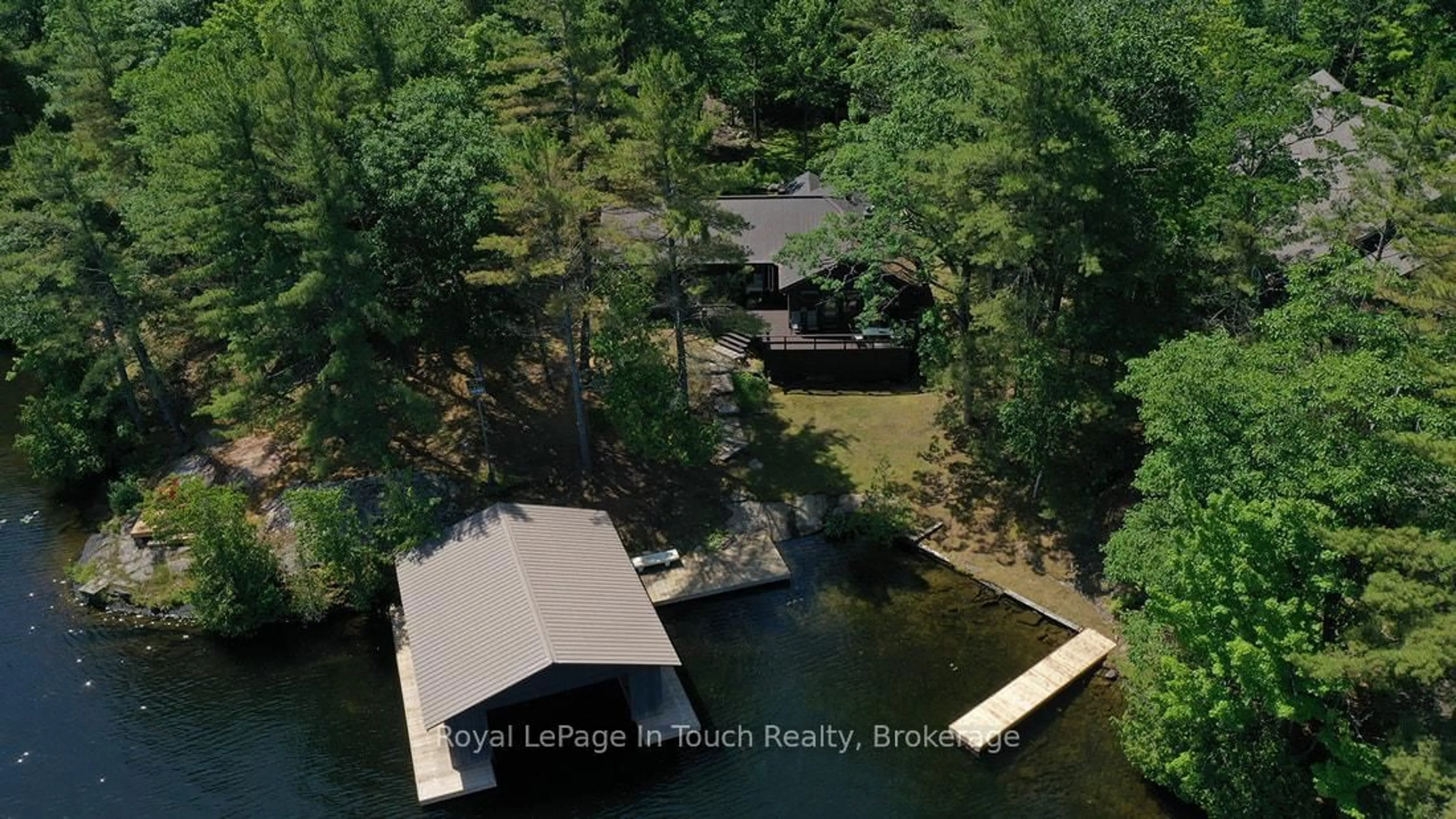 A pic from outside/outdoor area/front of a property/back of a property/a pic from drone, water/lake/river/ocean view for 211 Pickerel Point Rd, Georgian Bay Ontario L0K 1S0