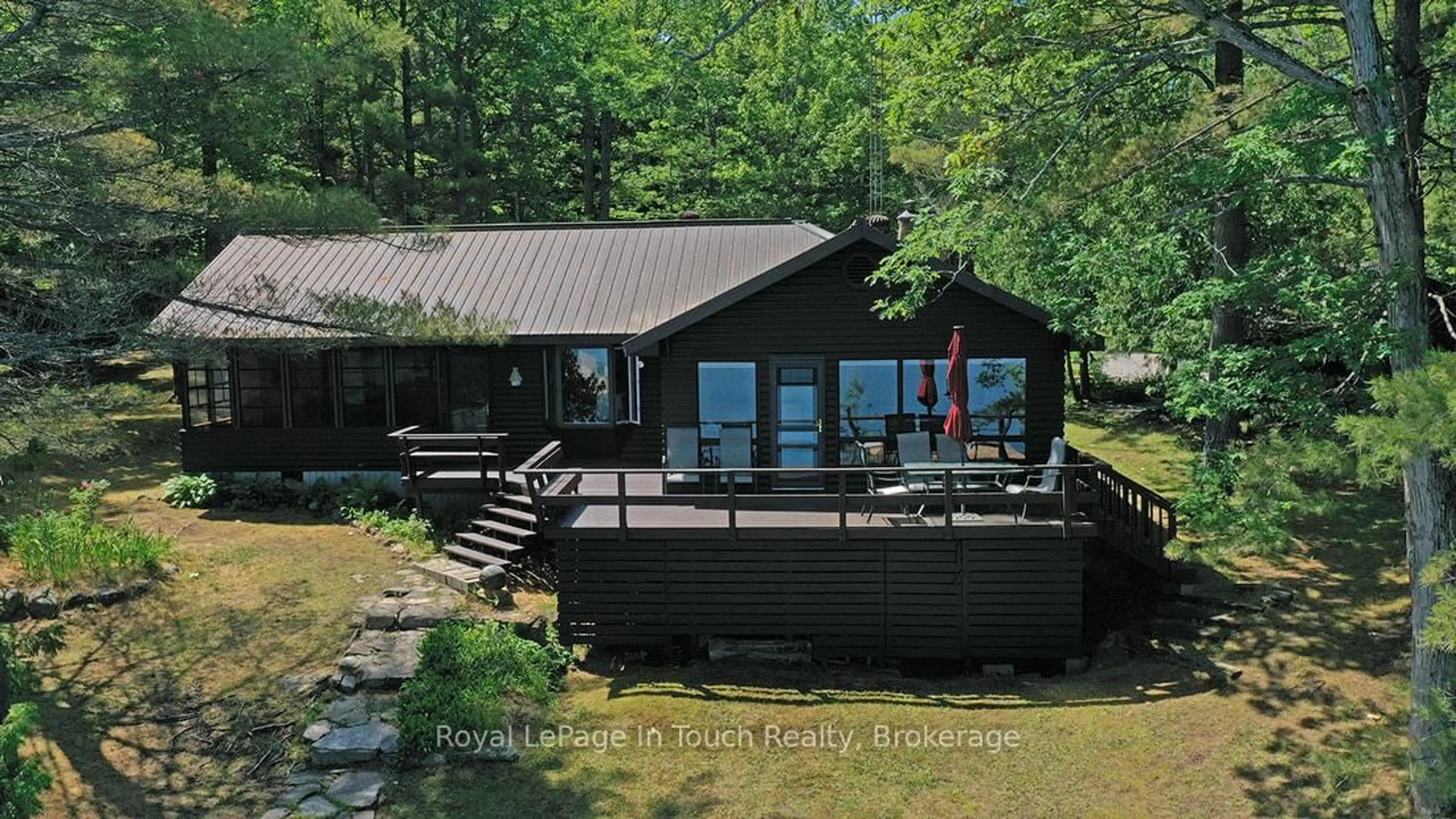 A pic from outside/outdoor area/front of a property/back of a property/a pic from drone, water/lake/river/ocean view for 211 Pickerel Point Rd, Georgian Bay Ontario L0K 1S0
