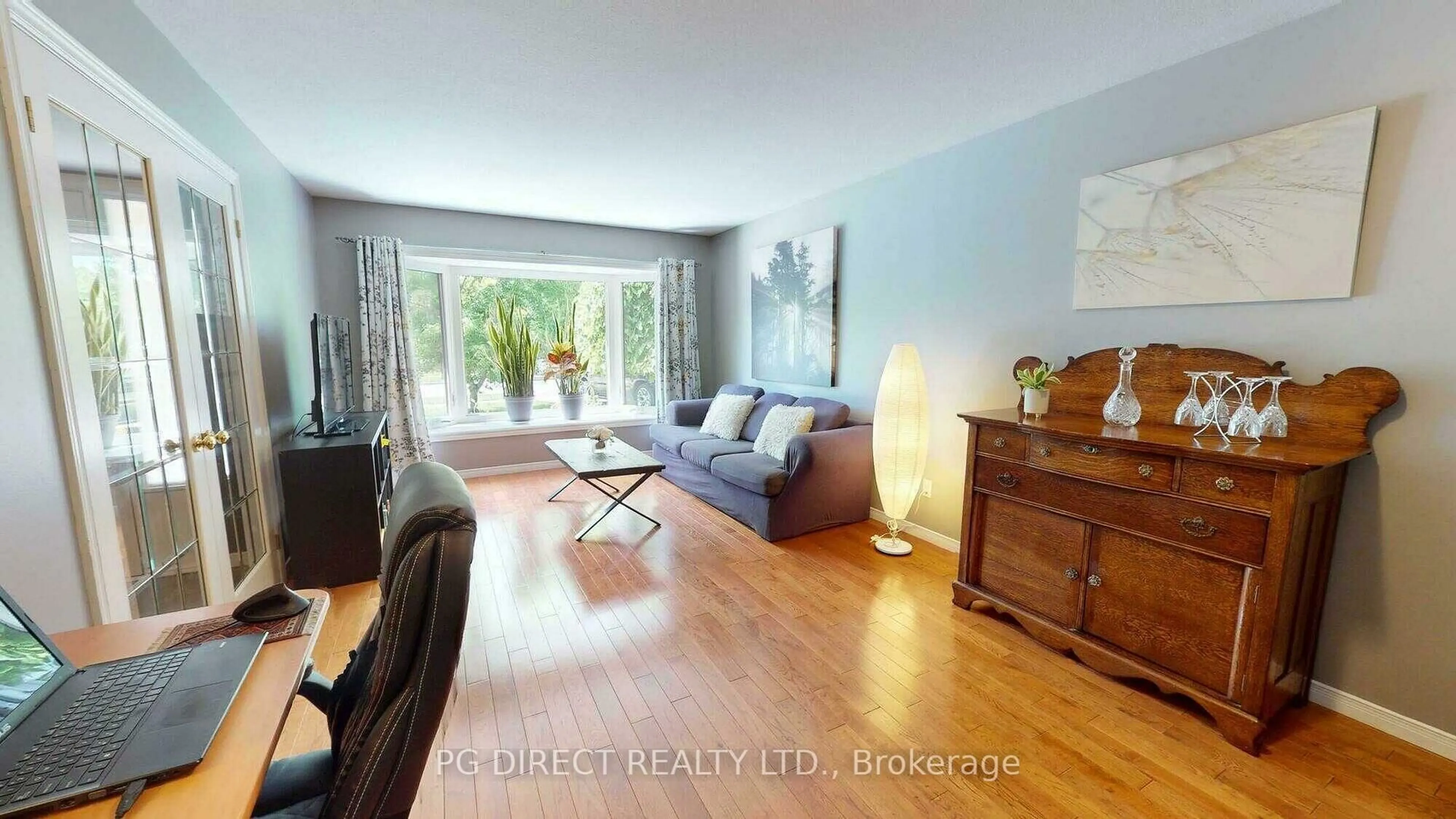 Living room with furniture, wood/laminate floor for 49 Peartree Cres, Guelph Ontario N1H 8J2