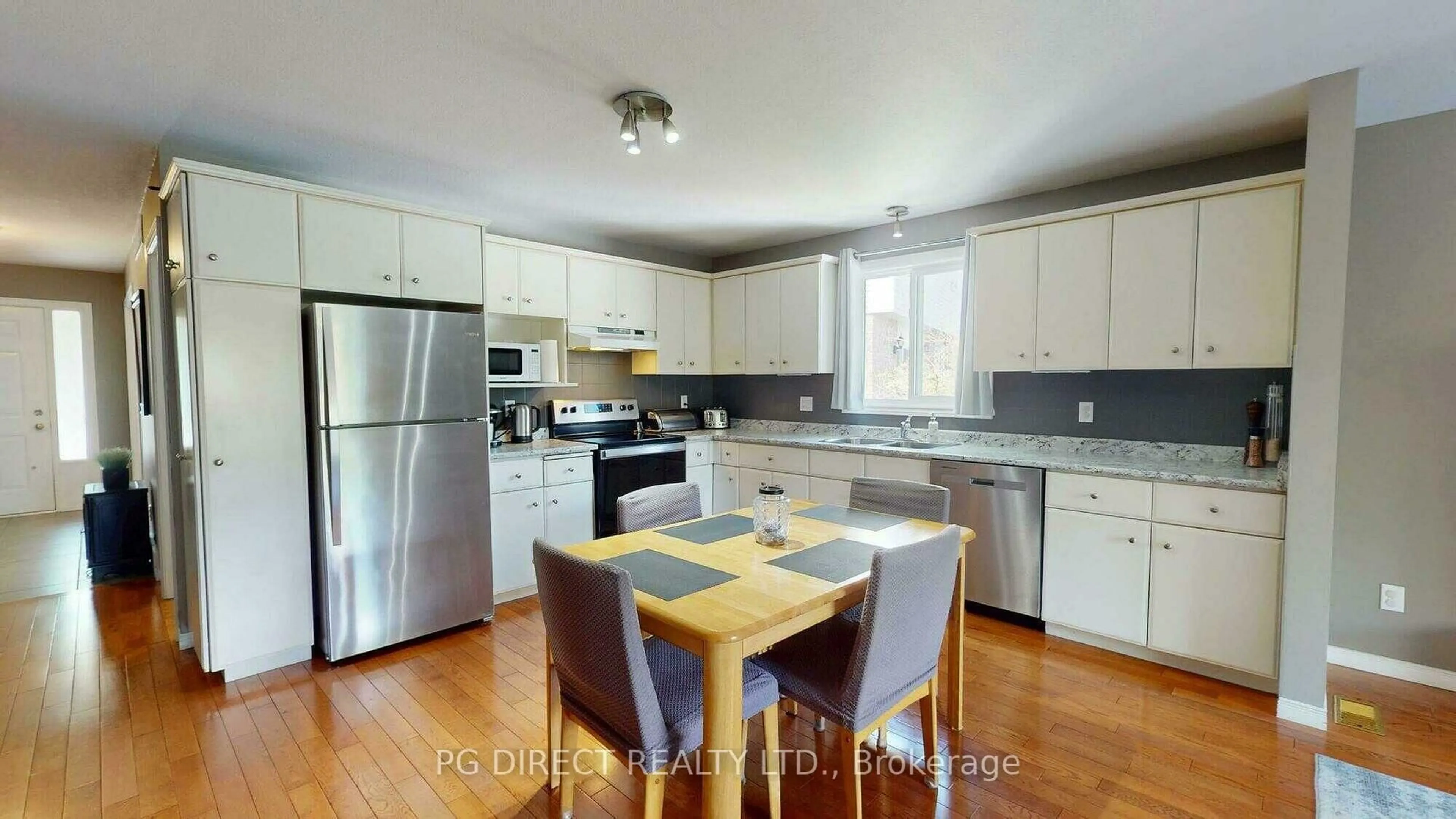 Open concept kitchen, wood/laminate floor for 49 Peartree Cres, Guelph Ontario N1H 8J2