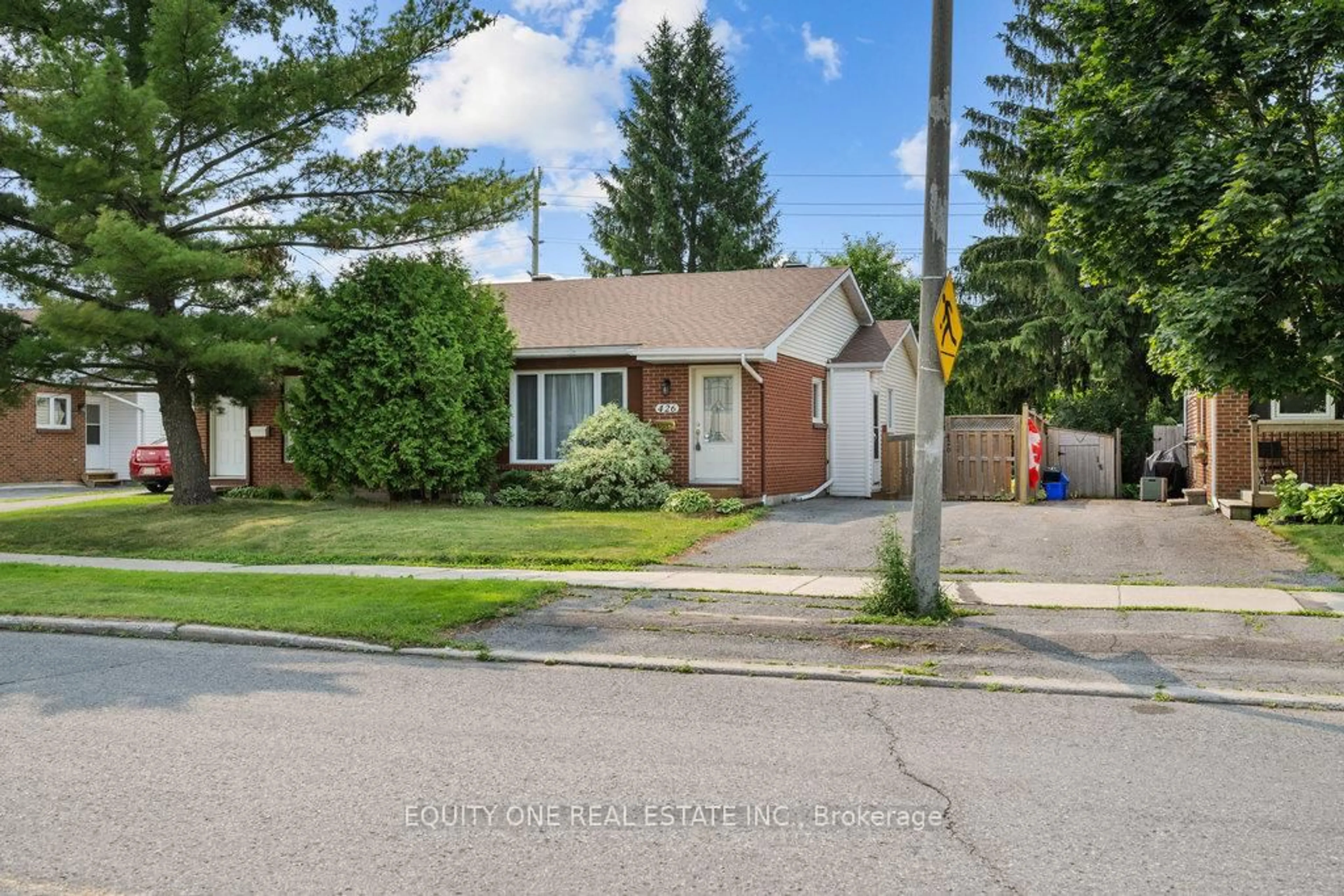Home with brick exterior material, street for 426 Woodfield Dr, Ottawa Ontario K2G 4E5