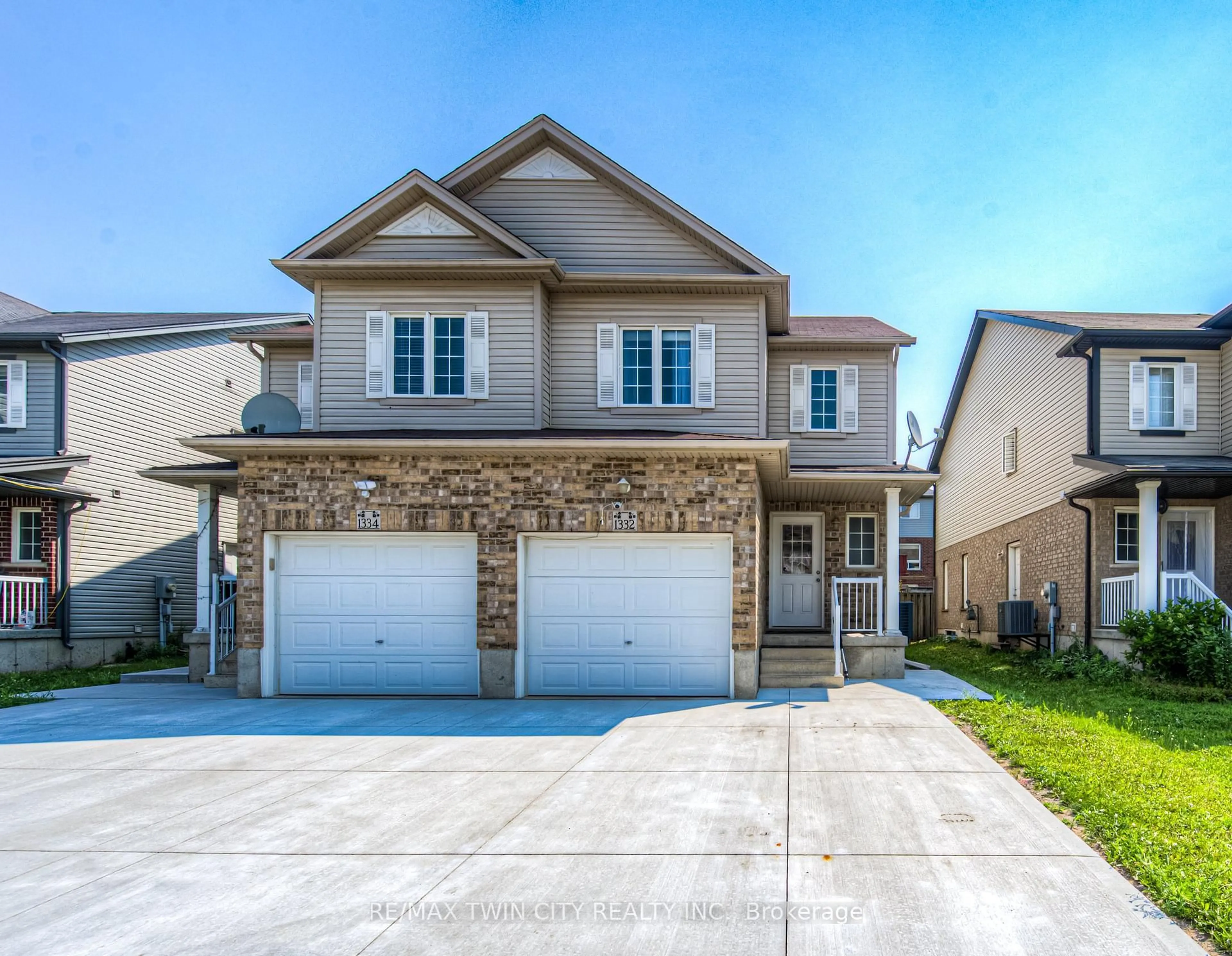 Home with brick exterior material, street for 1332 Countrystone Dr, Kitchener Ontario N2N 3R9