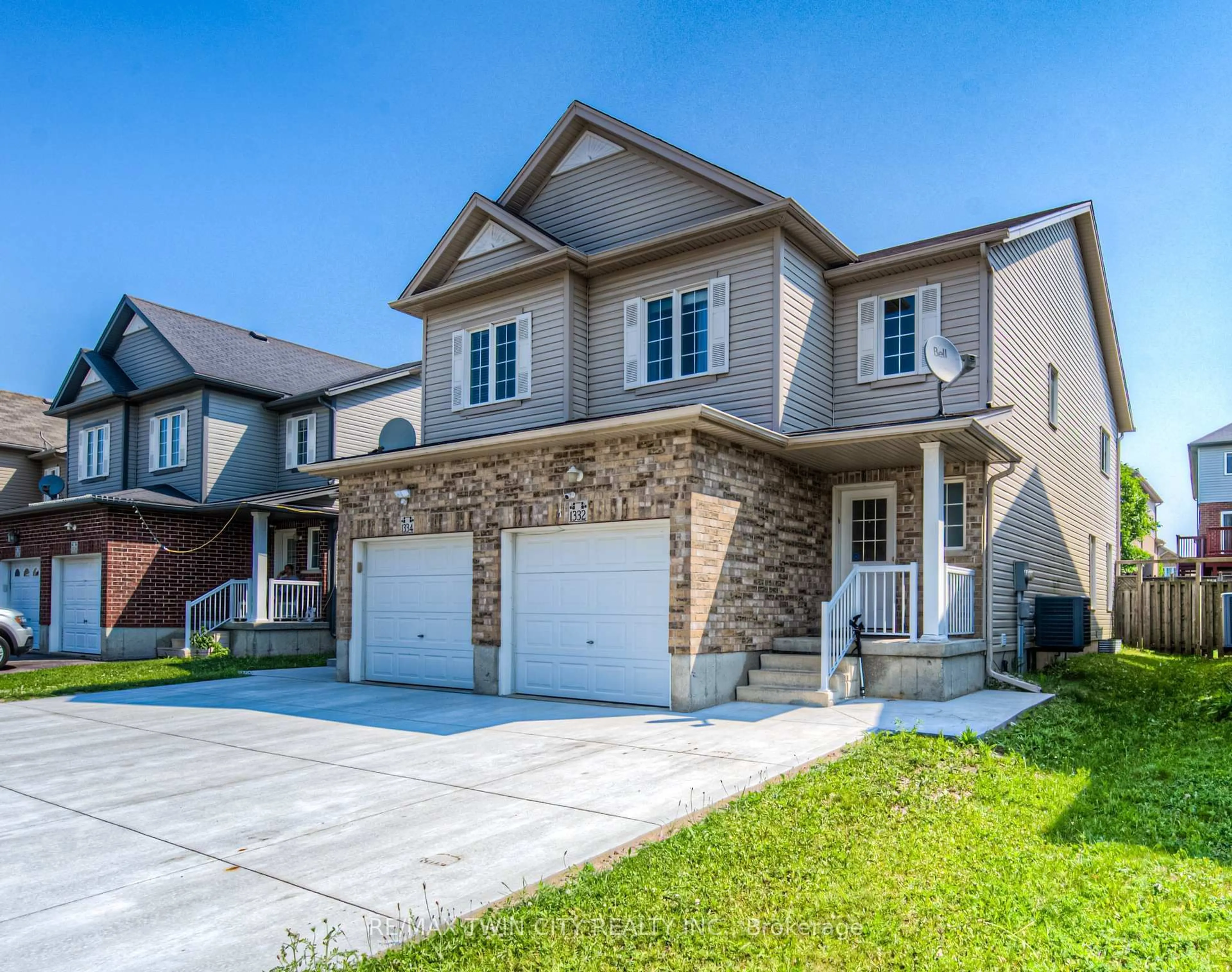 Home with brick exterior material, street for 1332 Countrystone Dr, Kitchener Ontario N2N 3R9