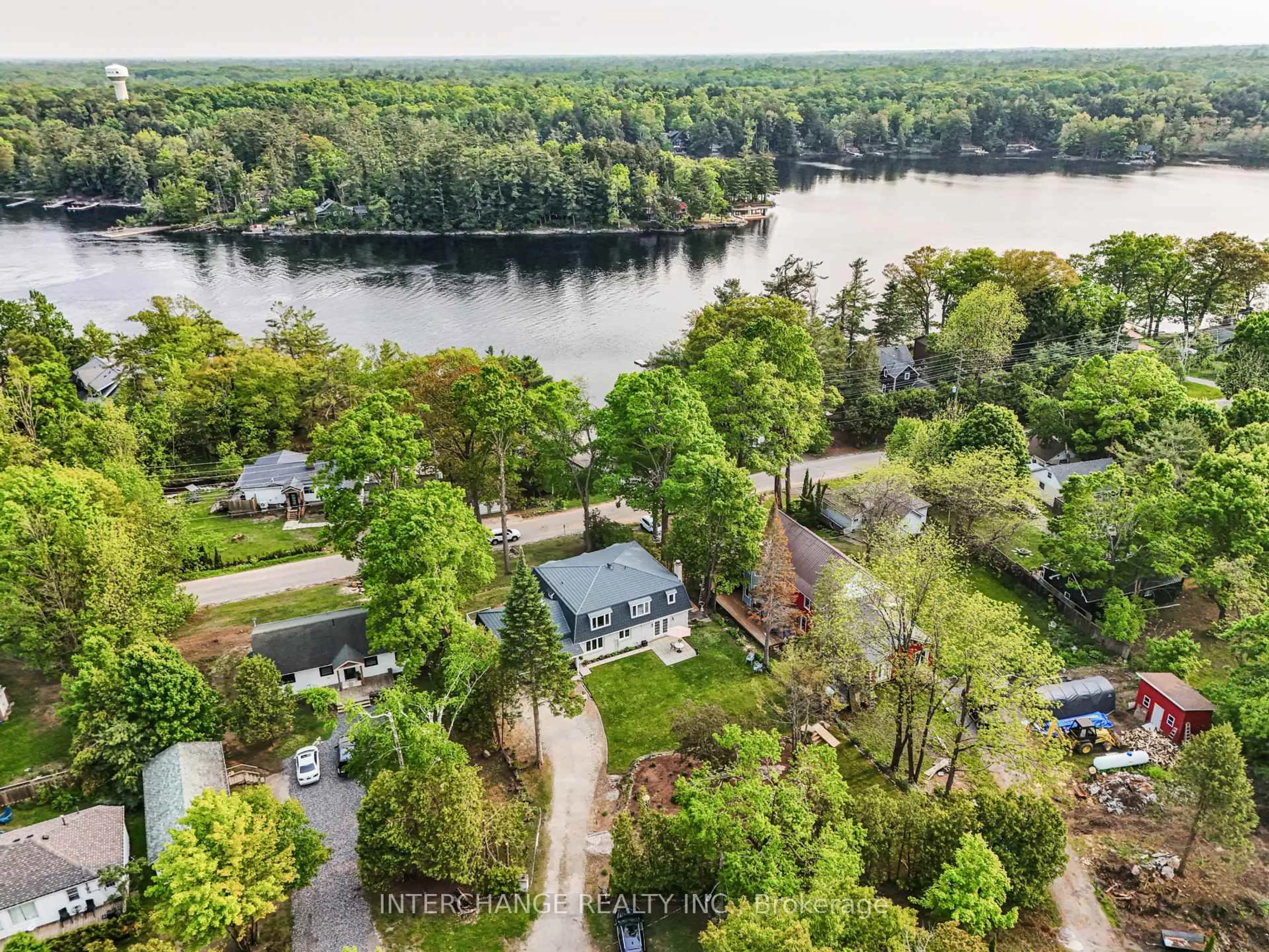 A pic from outside/outdoor area/front of a property/back of a property/a pic from drone, water/lake/river/ocean view for 1012 Mill St, Muskoka Lakes Ontario P0C 1A0