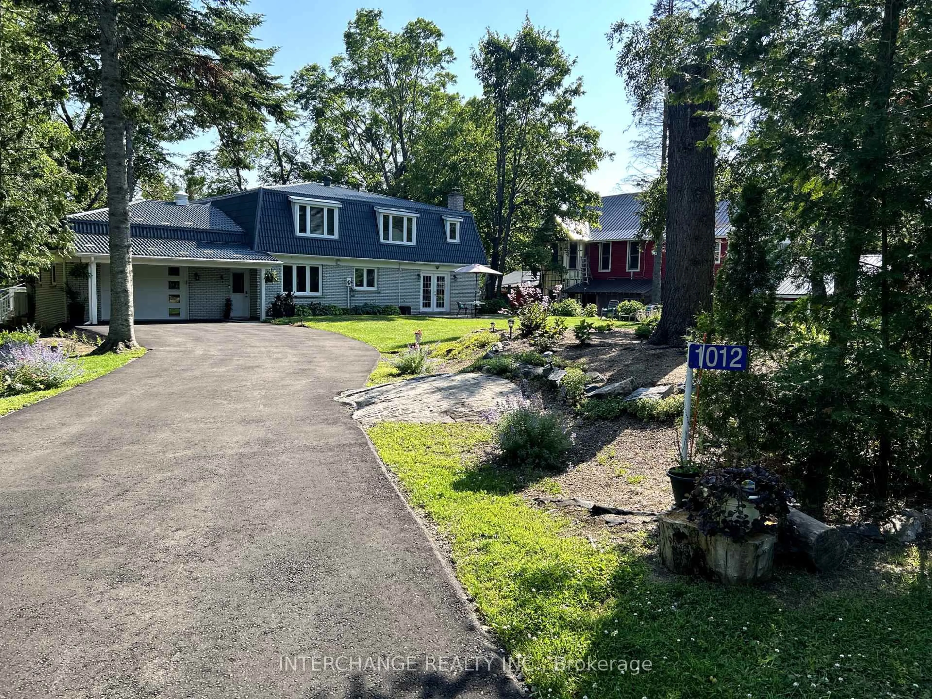 A pic from outside/outdoor area/front of a property/back of a property/a pic from drone, street for 1012 Mill St, Muskoka Lakes Ontario P0C 1A0