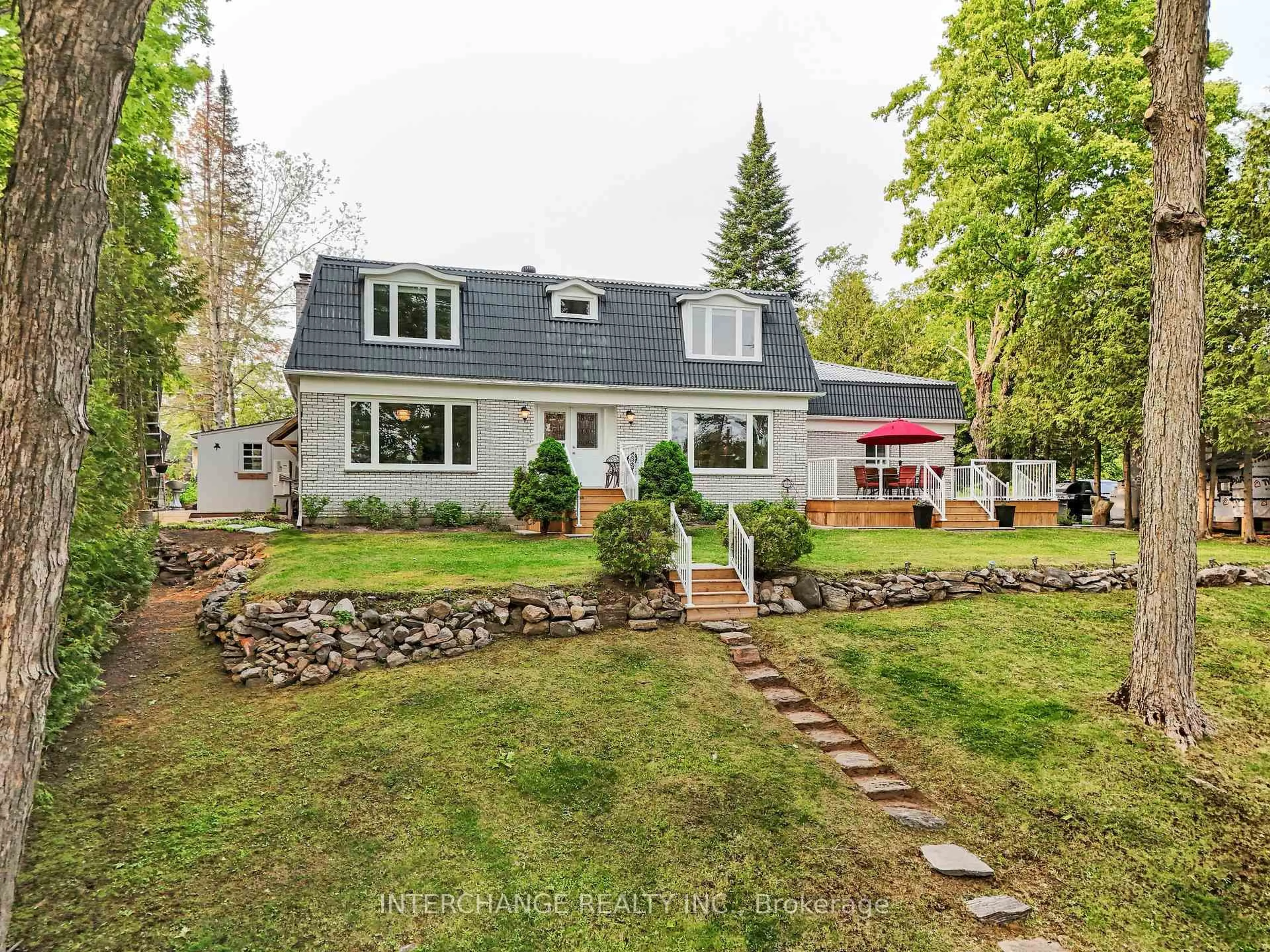 A pic from outside/outdoor area/front of a property/back of a property/a pic from drone, street for 1012 Mill St, Muskoka Lakes Ontario P0C 1A0