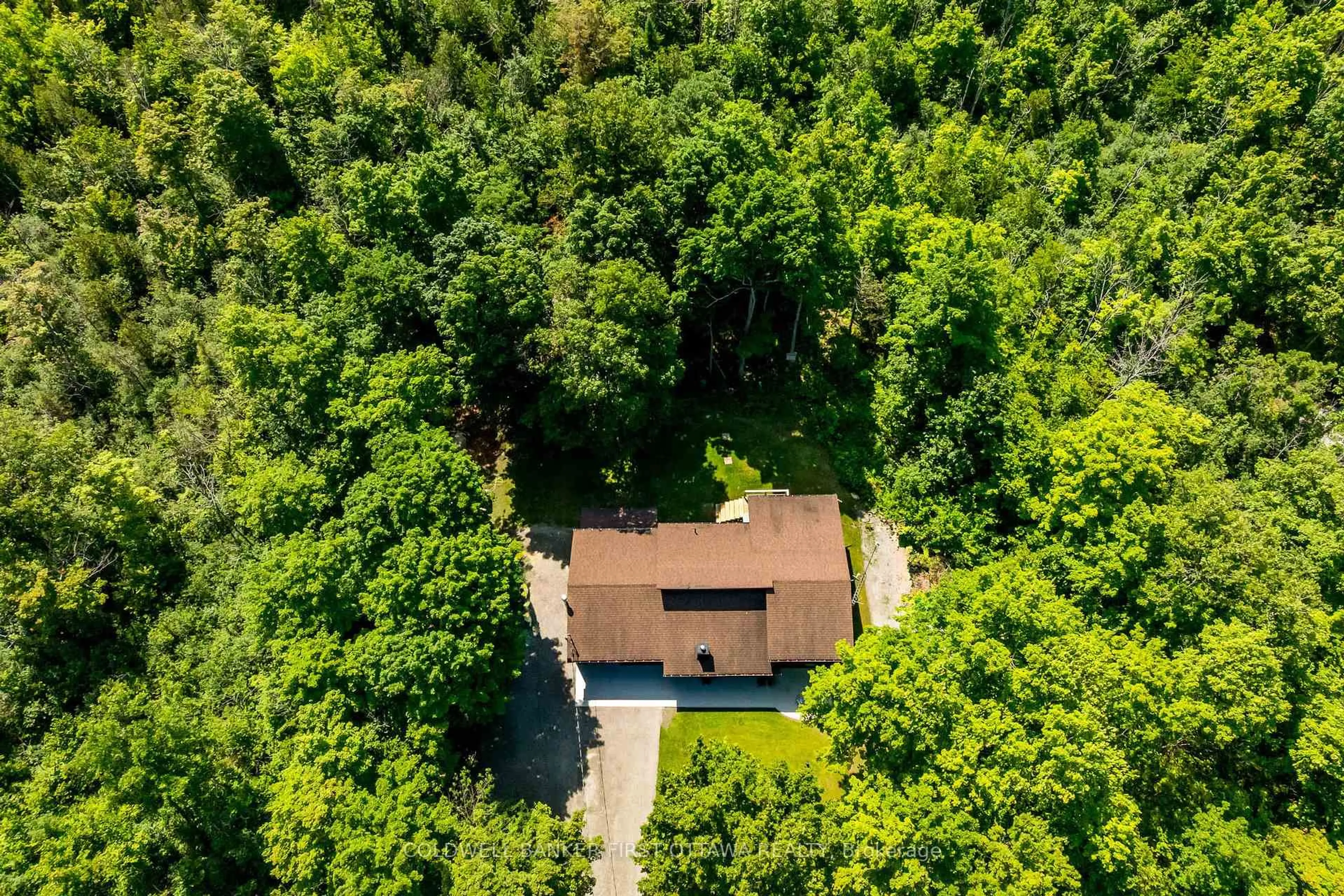 A pic from outside/outdoor area/front of a property/back of a property/a pic from drone, forest/trees view for 6779 Roger Stevens Dr, Smiths Falls Ontario K7A 4S6