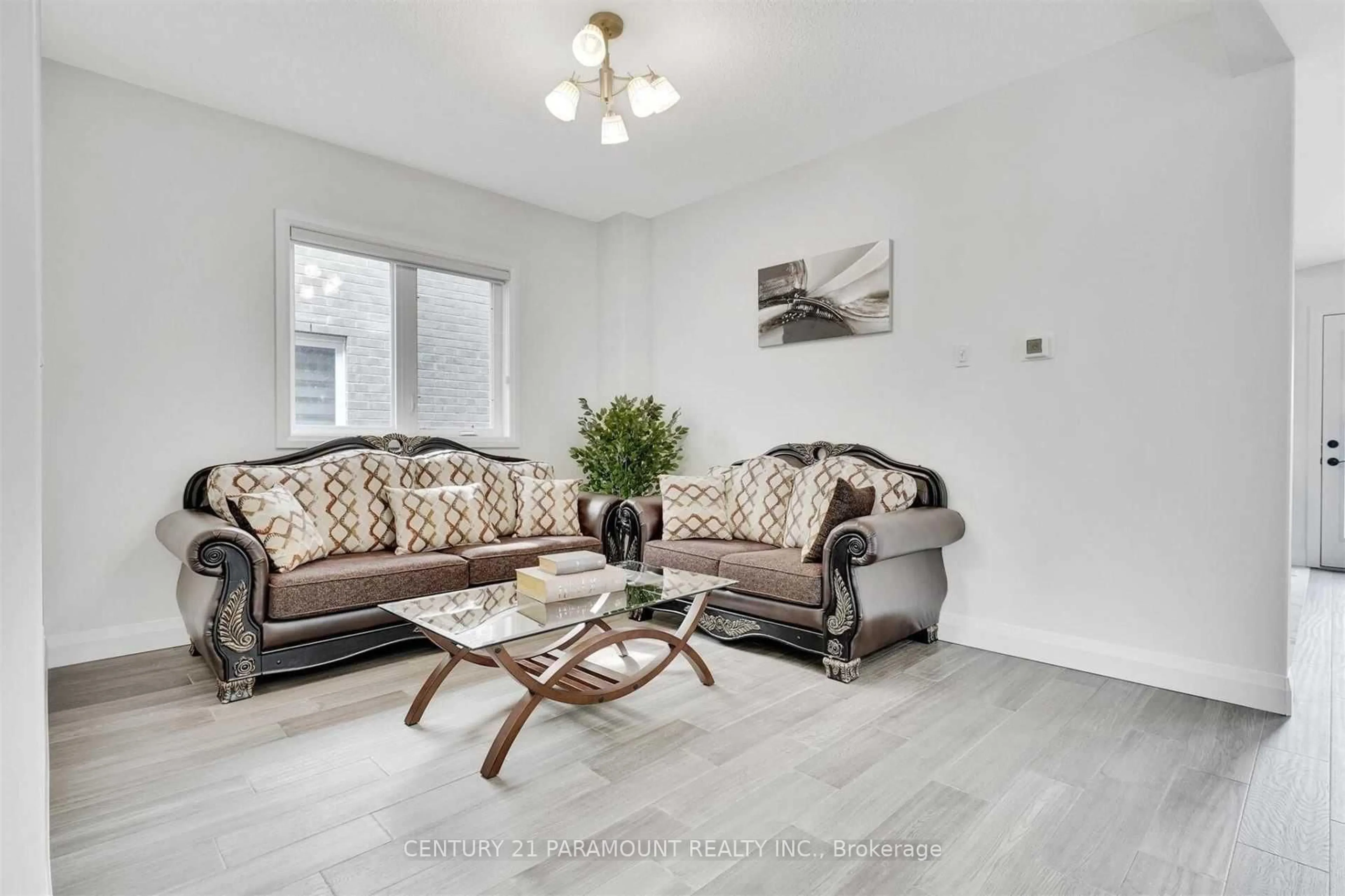 Living room with furniture, wood/laminate floor for 2997 Doyle Dr, London South Ontario N6M 2G8