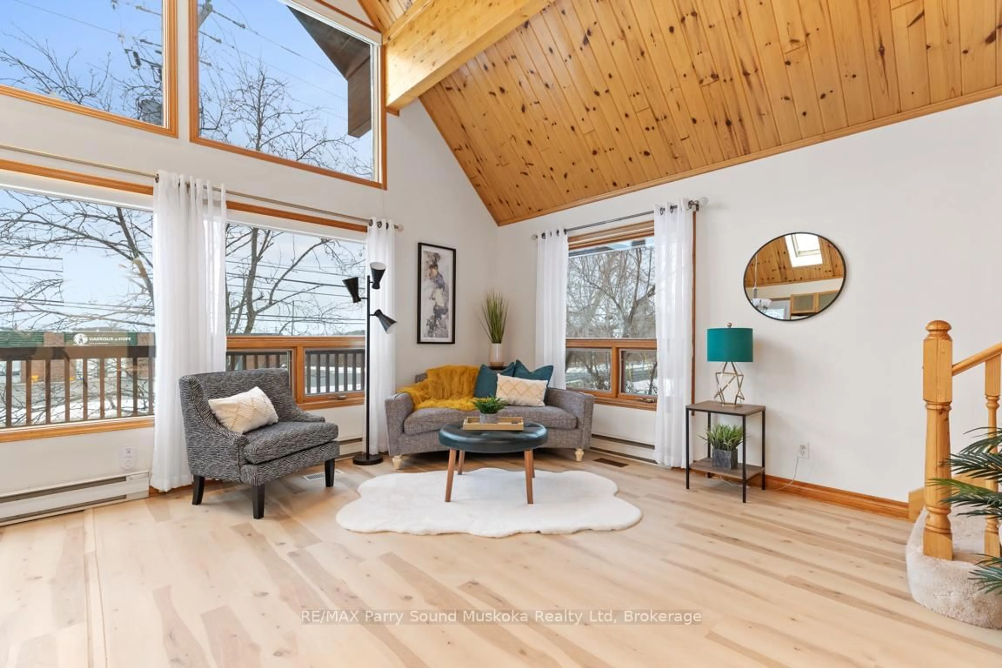 Living room with furniture, wood/laminate floor for 14 Emily St, Parry Sound Ontario P2A 2P3