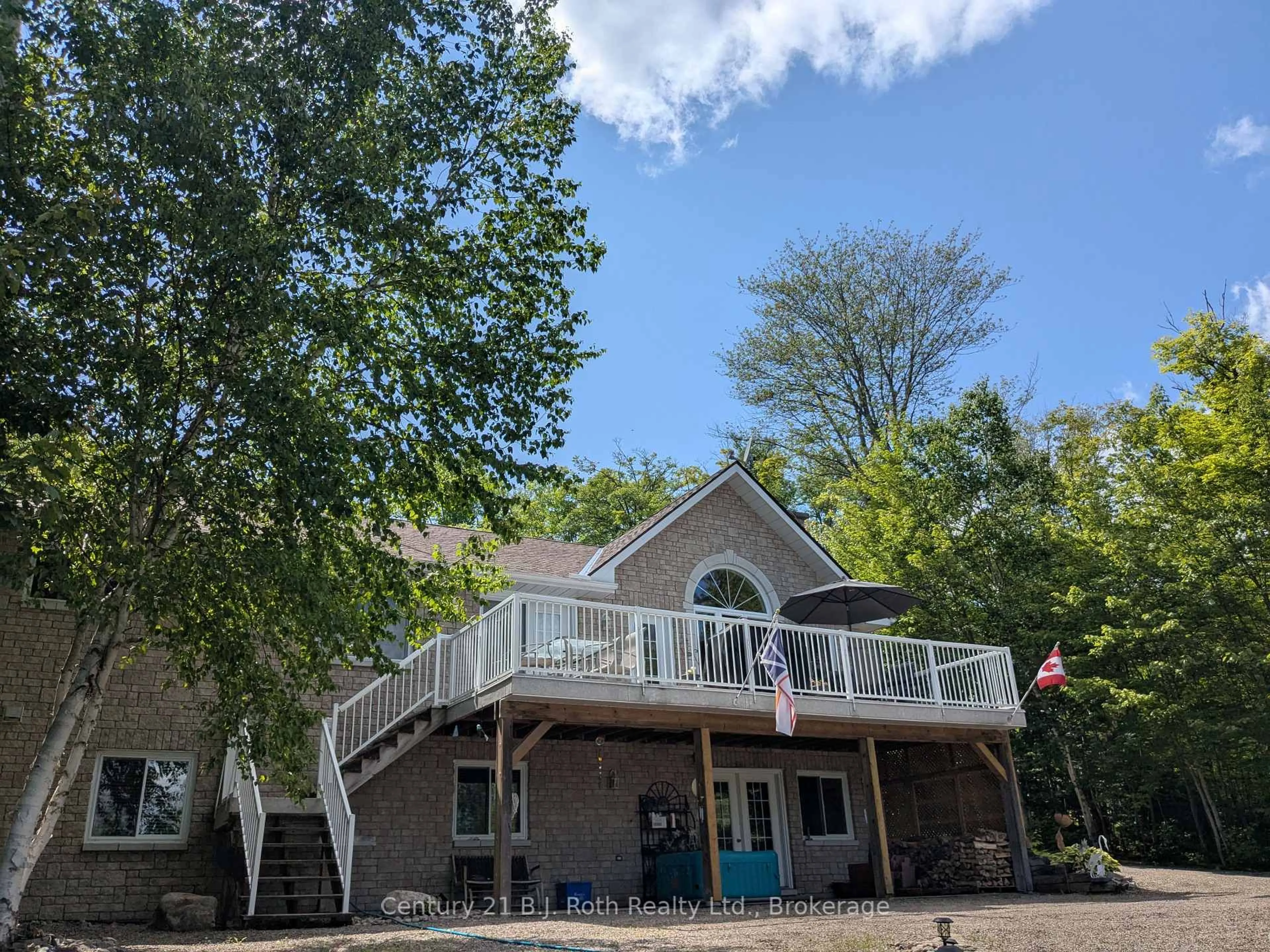 A pic from outside/outdoor area/front of a property/back of a property/a pic from drone, water/lake/river/ocean view for 77 Holden Rd, Magnetawan Ontario P0A 1P0