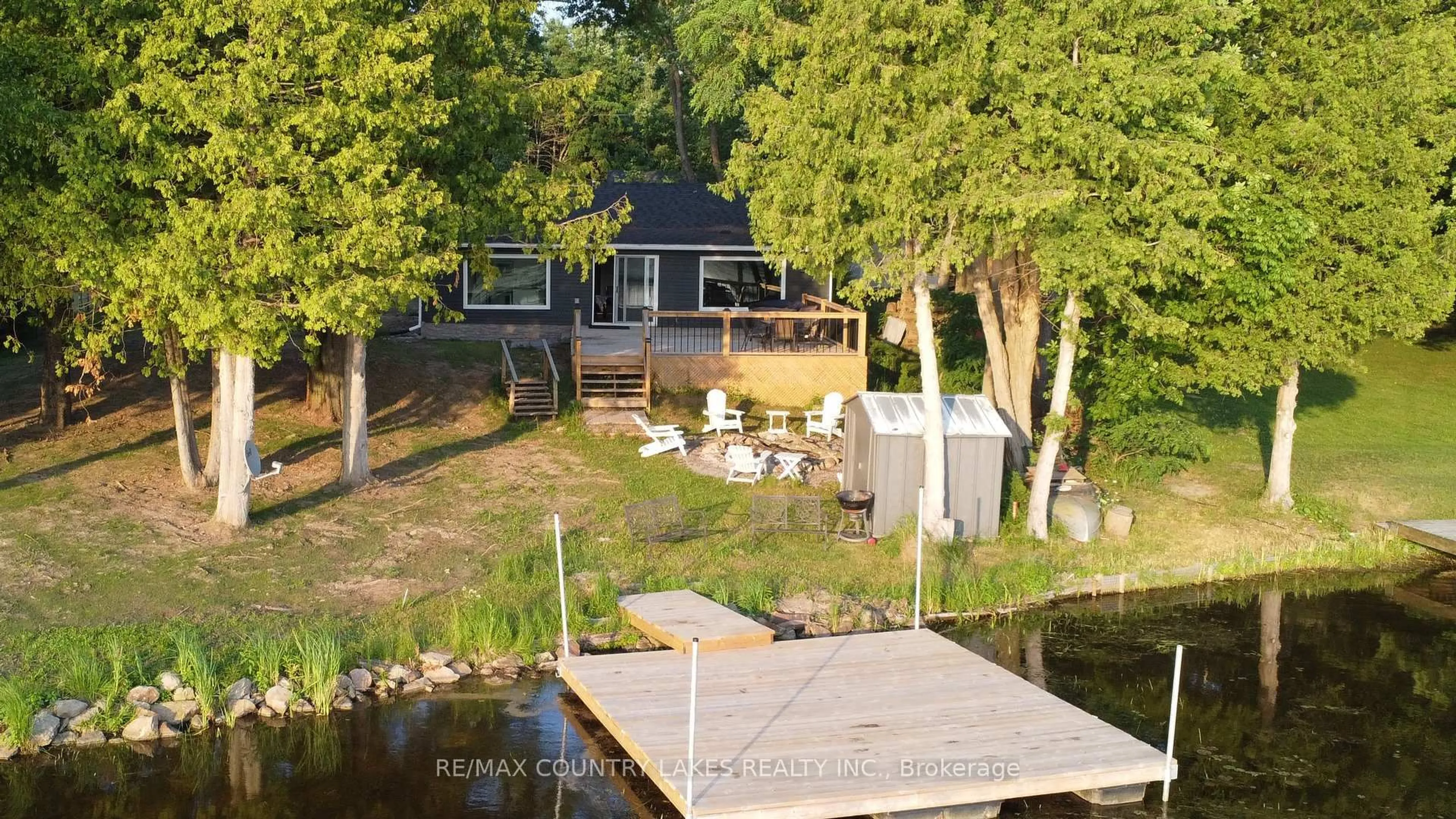 A pic from outside/outdoor area/front of a property/back of a property/a pic from drone, water/lake/river/ocean view for 10 Rockside Lane, Kawartha Lakes Ontario L0K 1B0