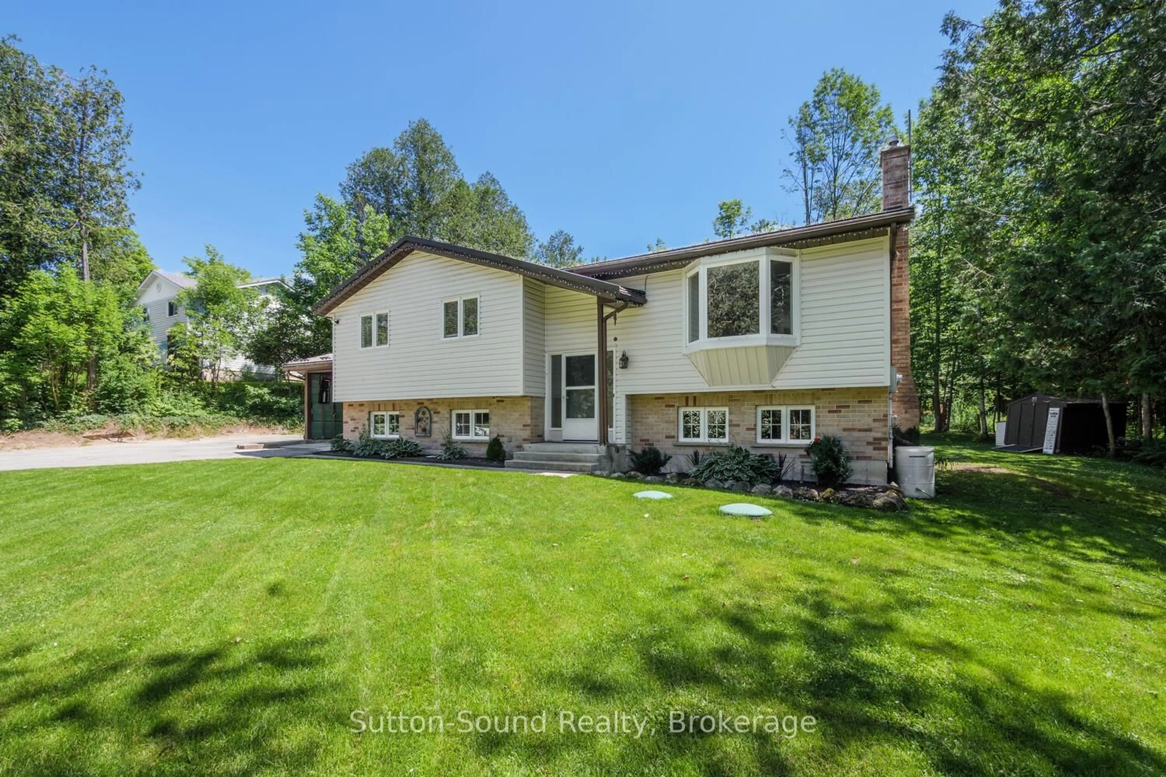 Home with vinyl exterior material, street for 222416 Derby Keppel Tline Townline, Georgian Bluffs Ontario N4K 5N7