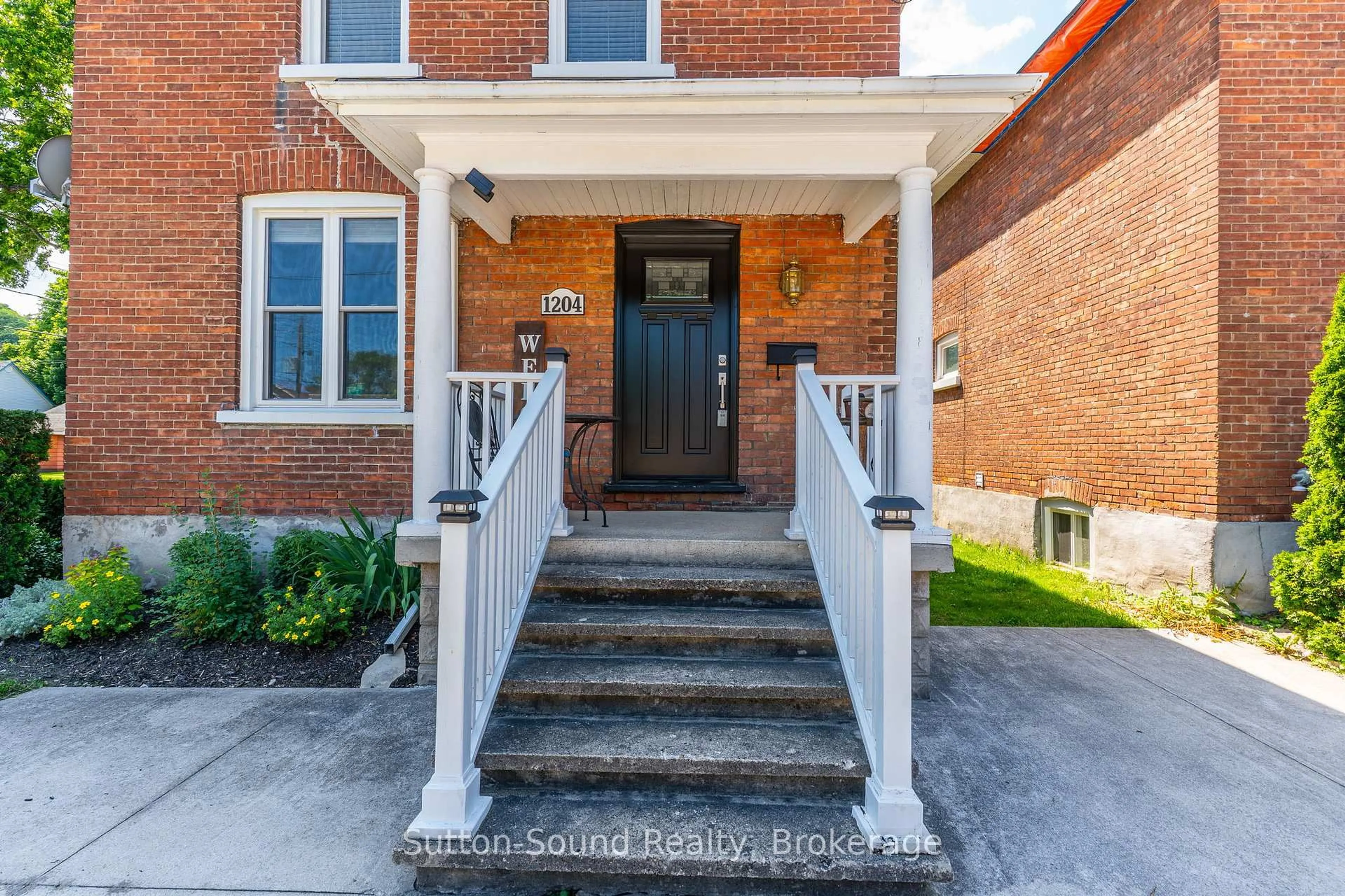 Home with brick exterior material, street for 1204 3rd A Ave, Owen Sound Ontario N4K 4T7