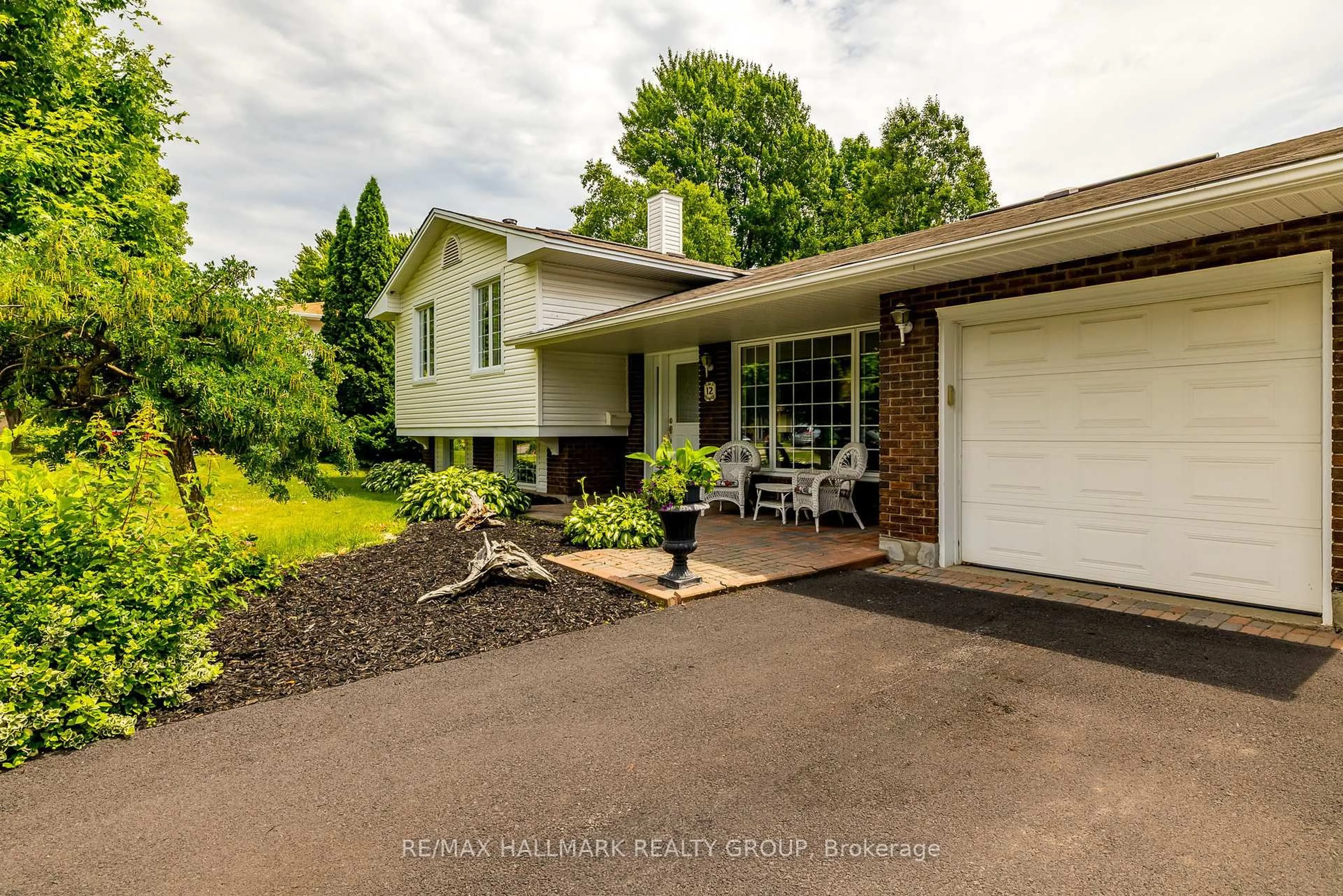 Home with vinyl exterior material, street for 12 Ancona Cres, Ottawa Ontario K2G 0N8